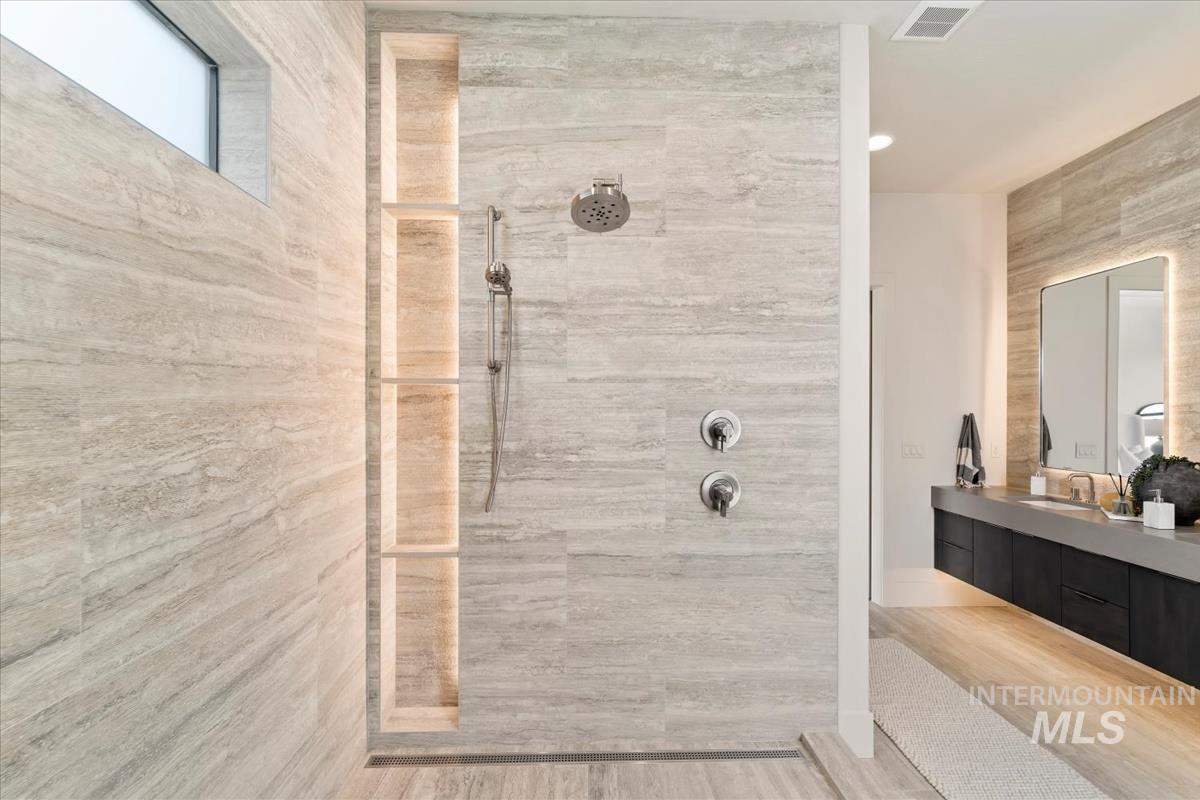 Bathroom with a walk in shower and vanity