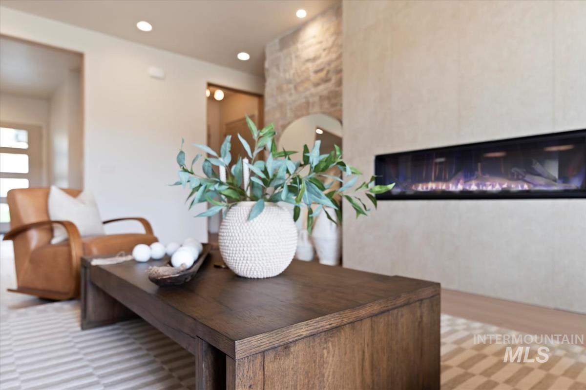 Detailed view of a glass covered fireplace and recessed lighting