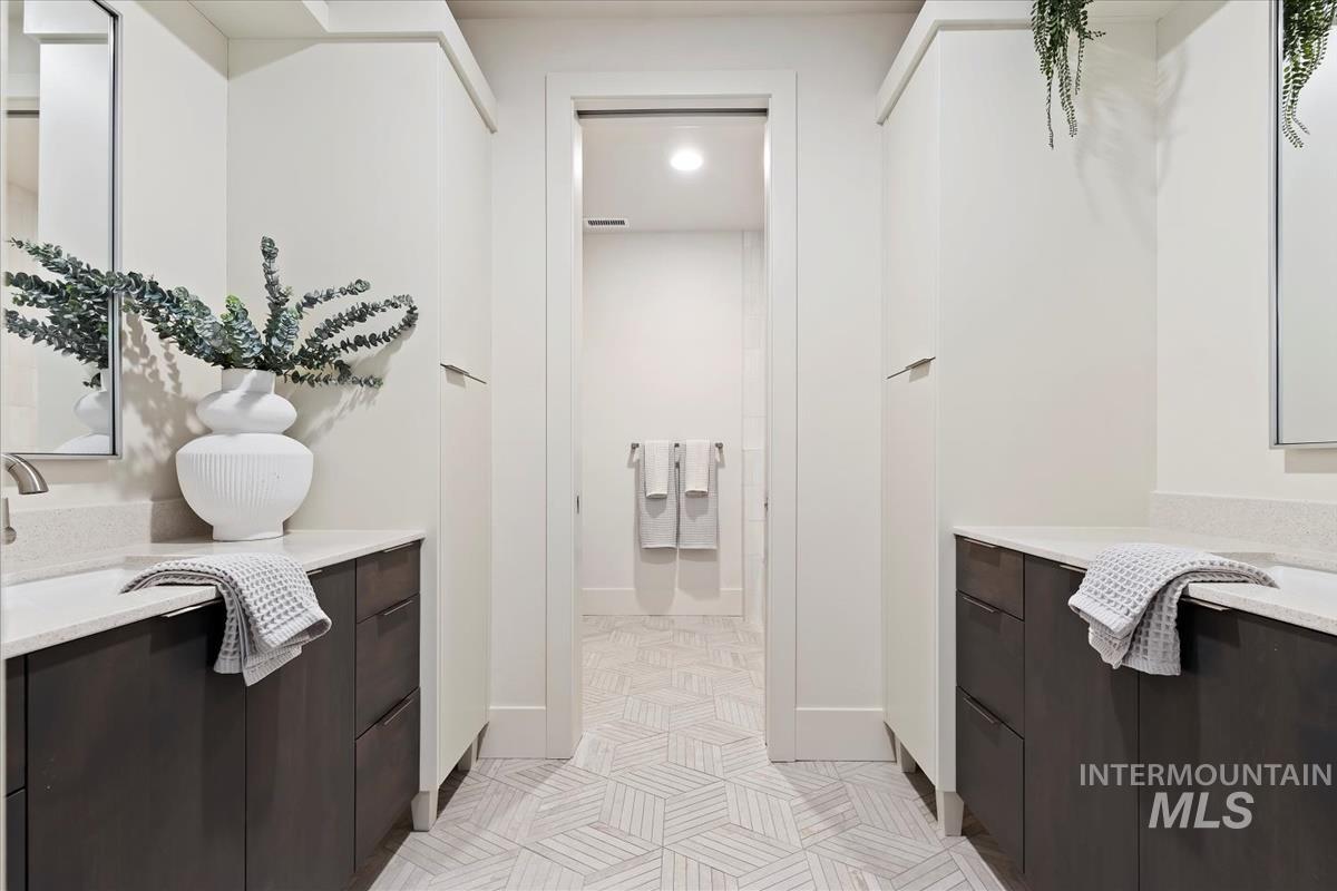 Bathroom with vanity and light tile patterned flooring