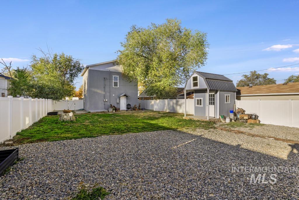 Fenced backyard with a shed
