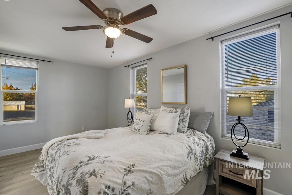Bedroom featuring wood finished floors and ceiling fan