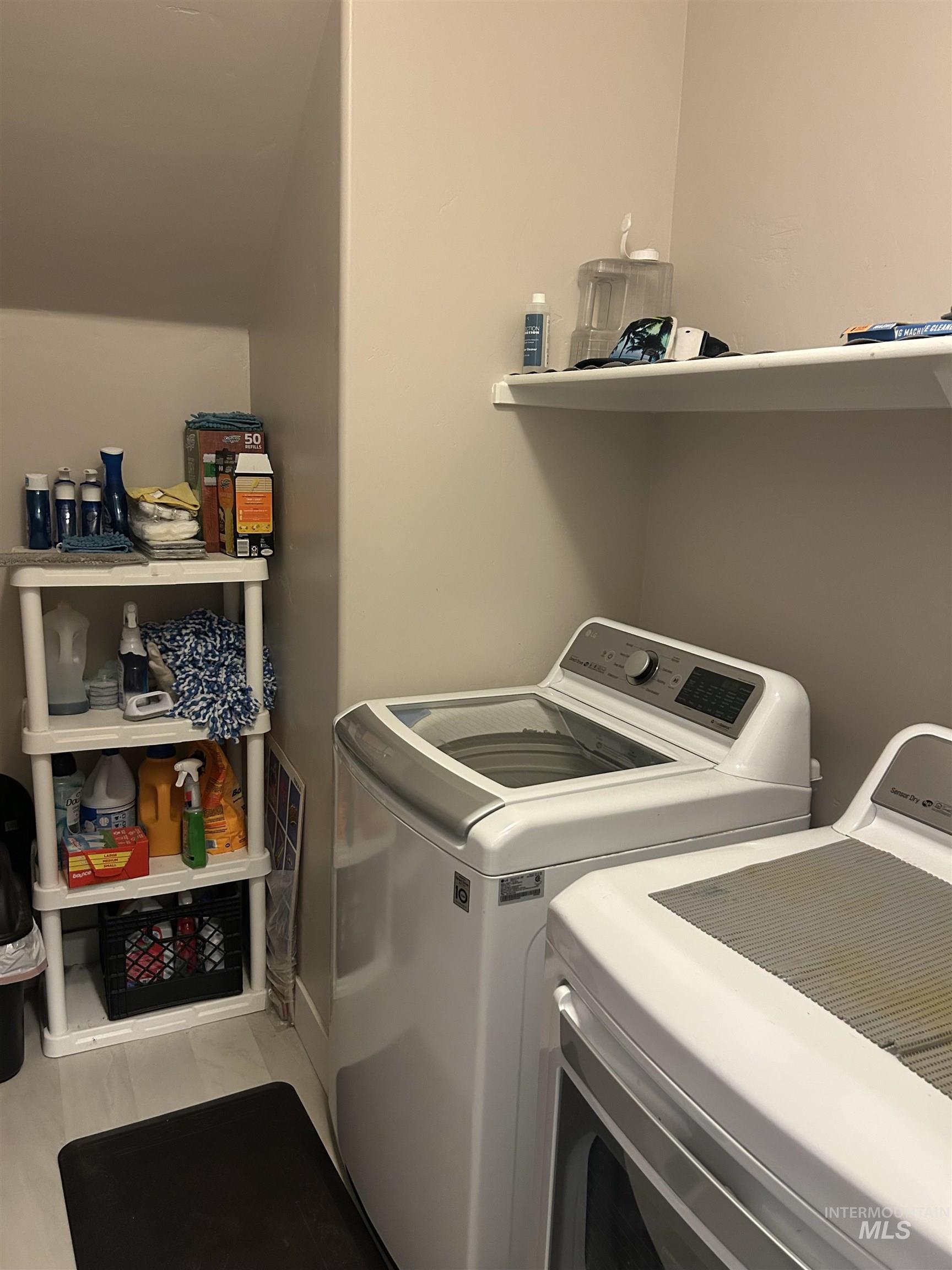 Laundry area featuring independent washer and dryer