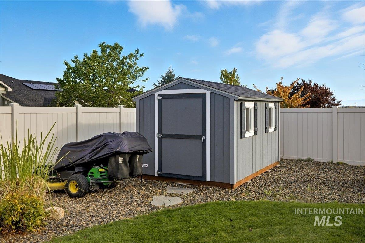 View of shed featuring a fenced backyard