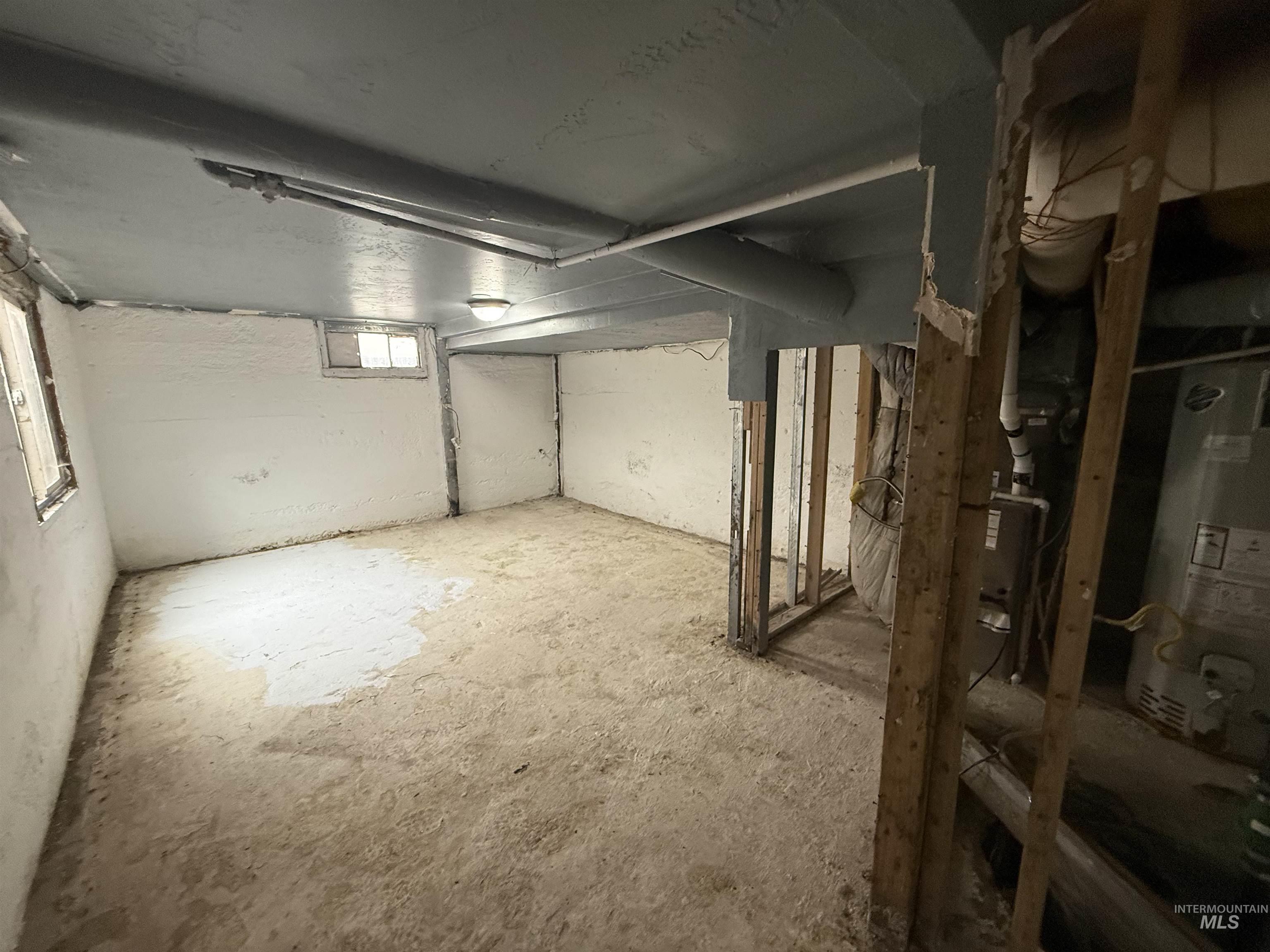 Basement featuring water heater