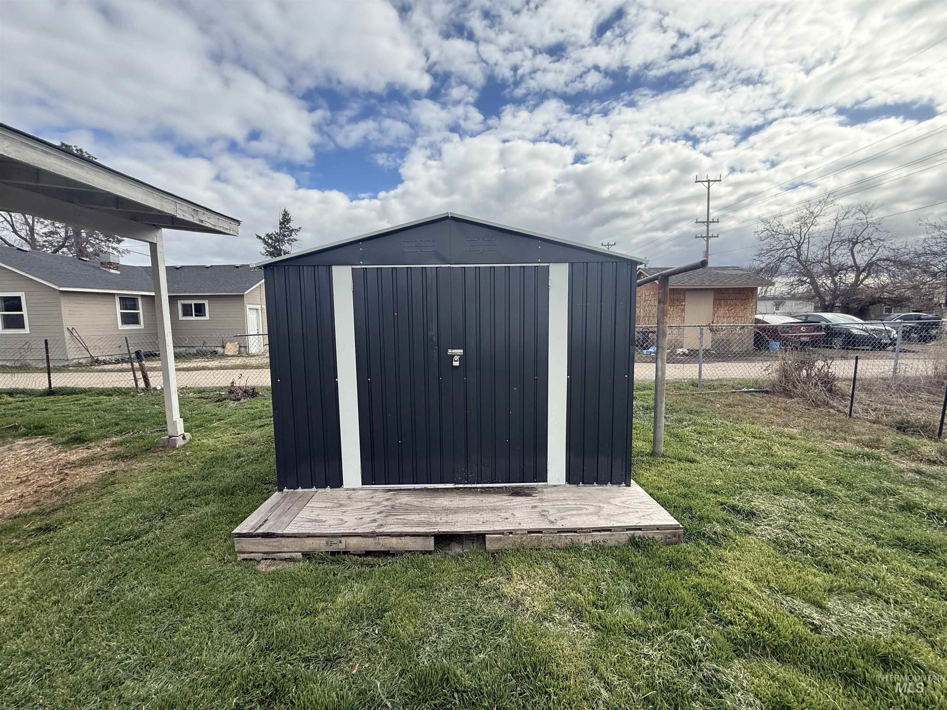 View of shed featuring a fenced backyard