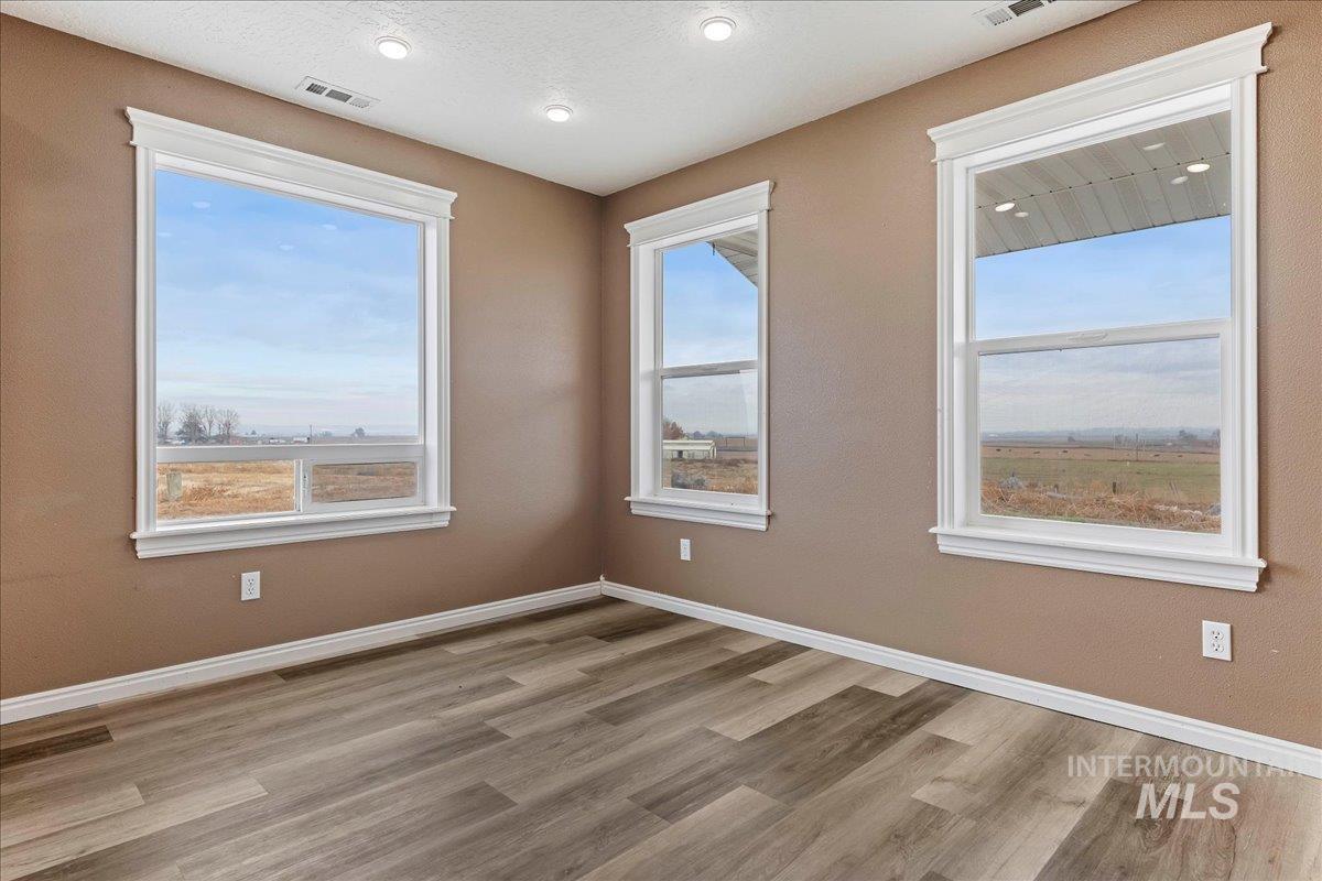 Spare room with light wood-type flooring and recessed lighting