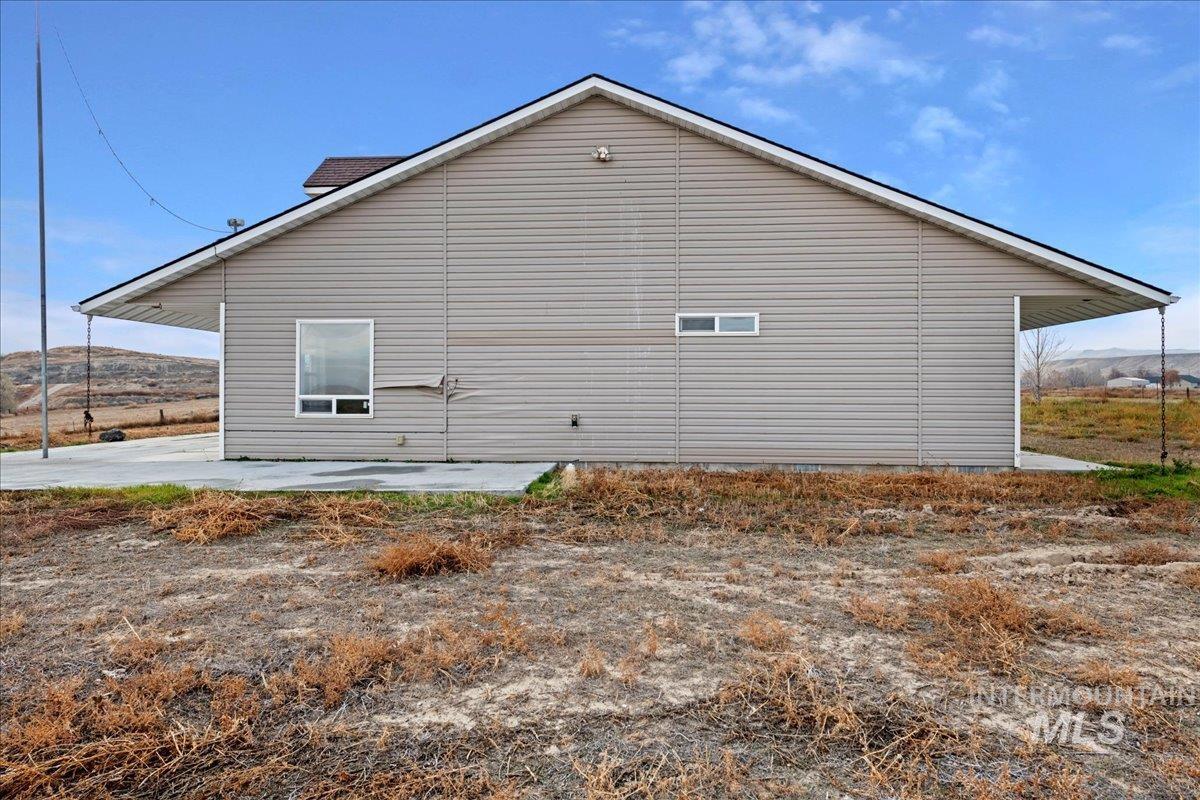 View of side of property featuring a patio area