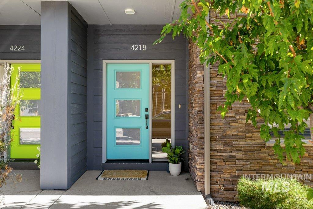 View of exterior entry with stone siding