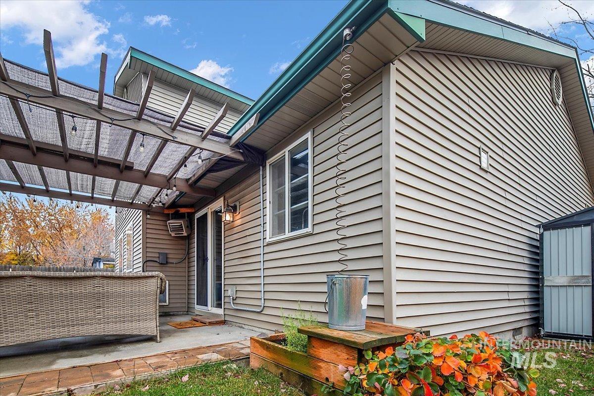 View of side of home featuring a patio area