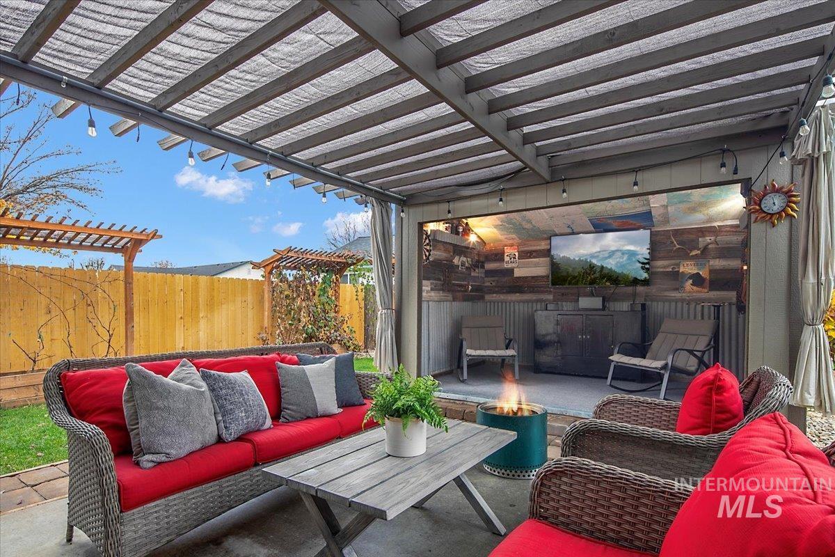 View of patio / terrace featuring a pergola and an outdoor living space