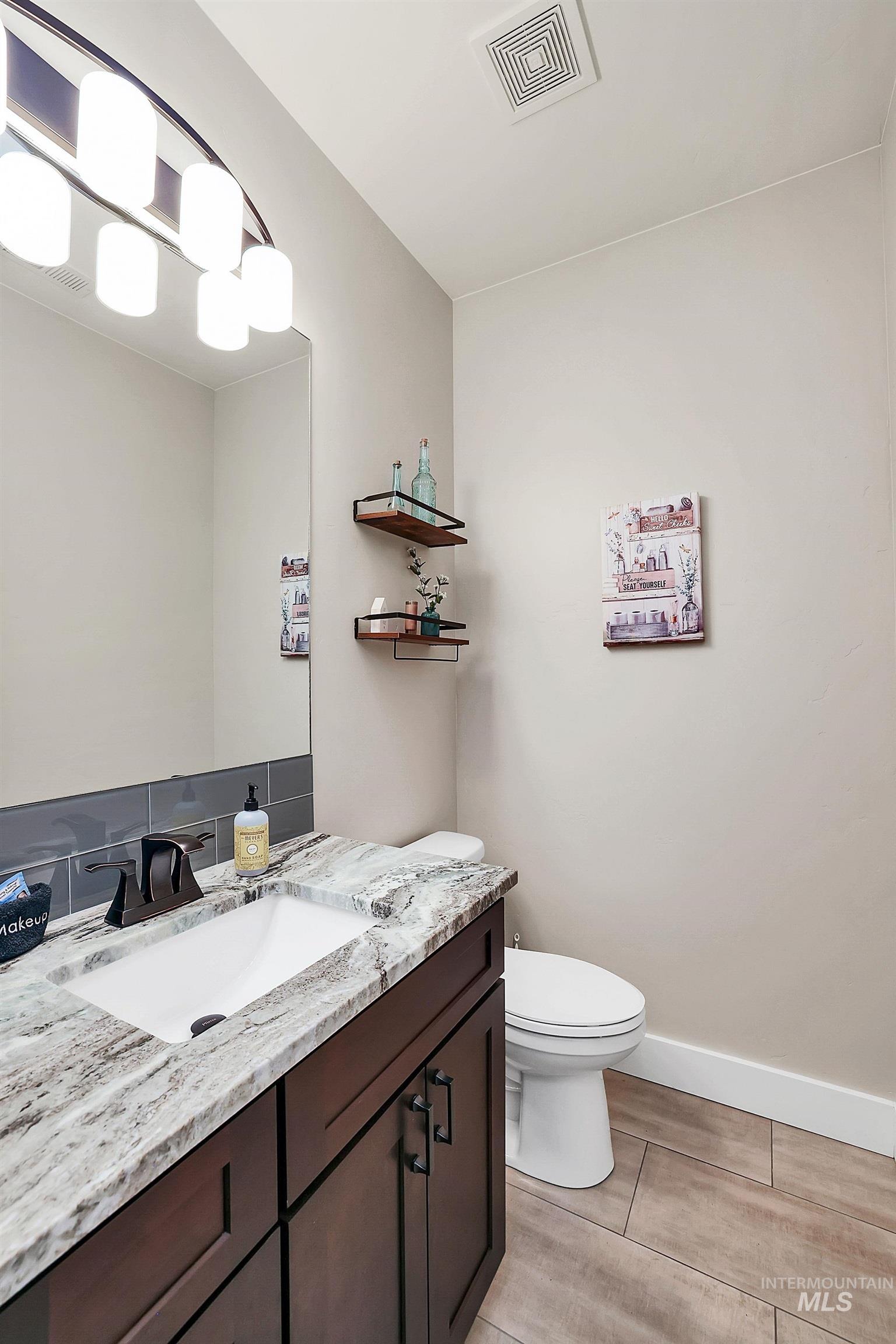 Bathroom with vanity and wood finish floors