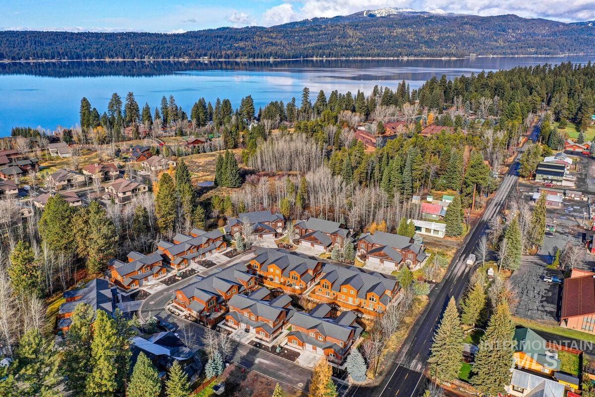 Aerial perspective of suburban area featuring a water and mountain view