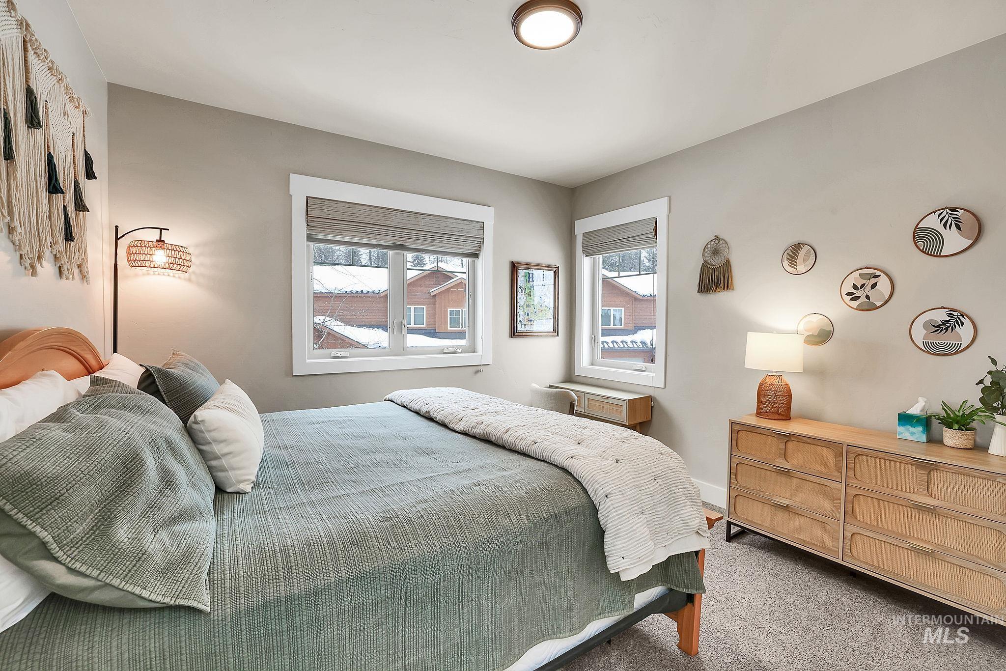 Carpeted bedroom with baseboards
