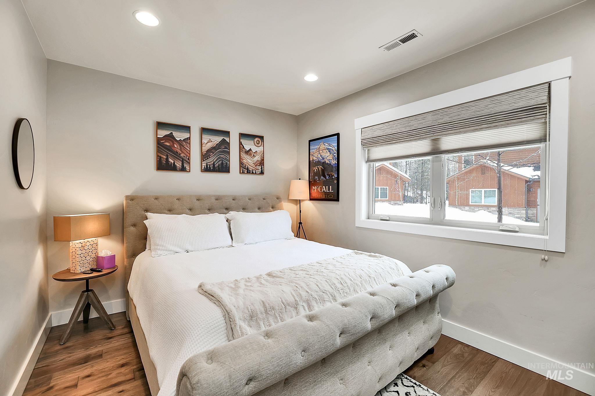 Bedroom featuring wood finished floors and recessed lighting
