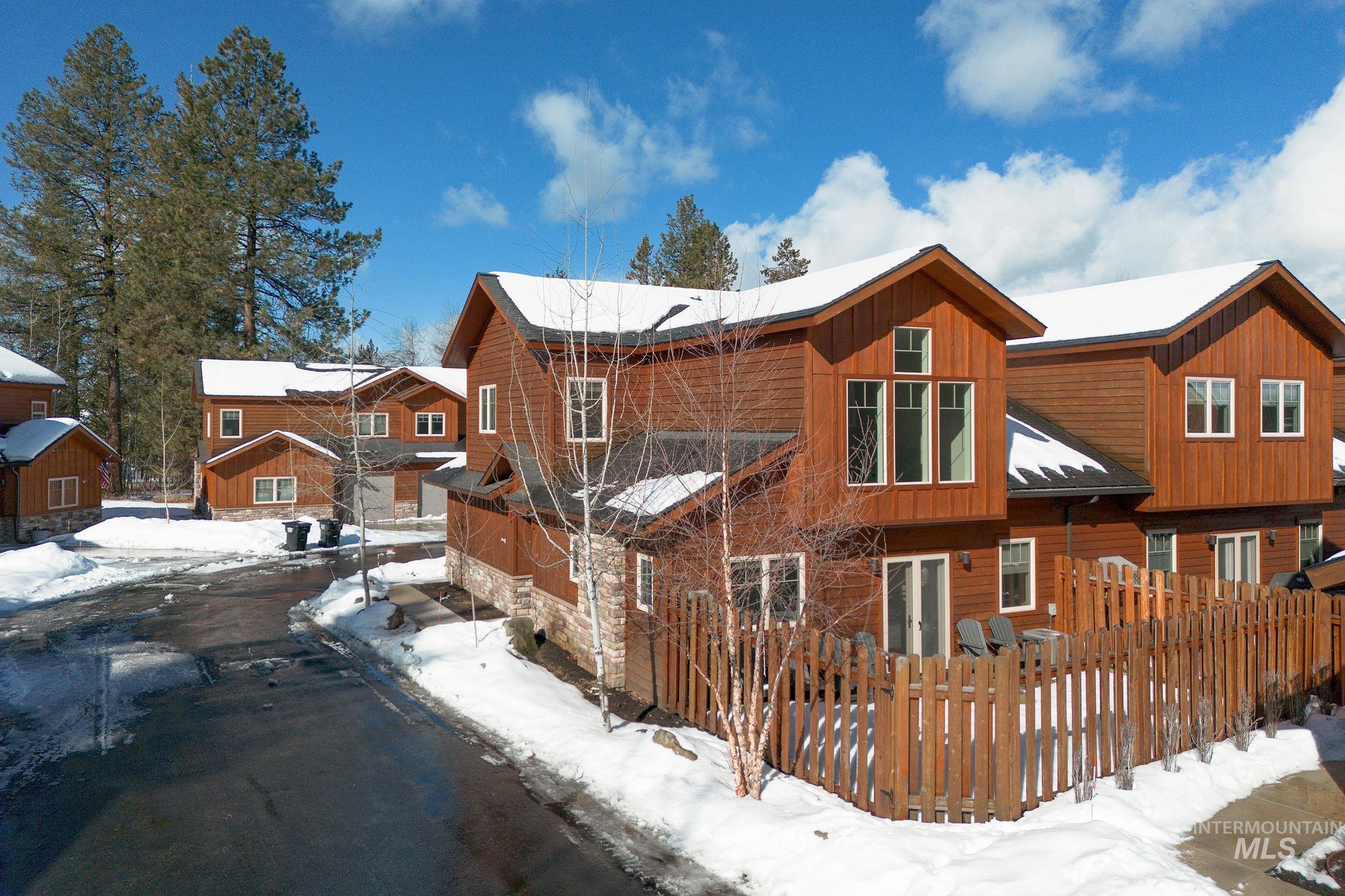 View of snowy exterior featuring board and batten siding