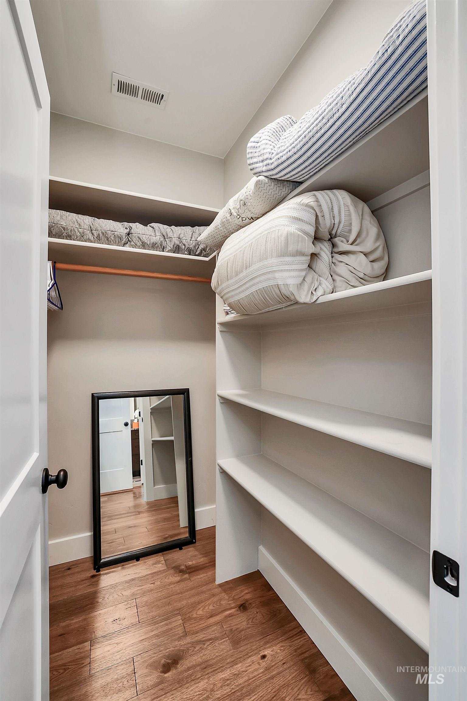 Walk in closet featuring light wood-type flooring