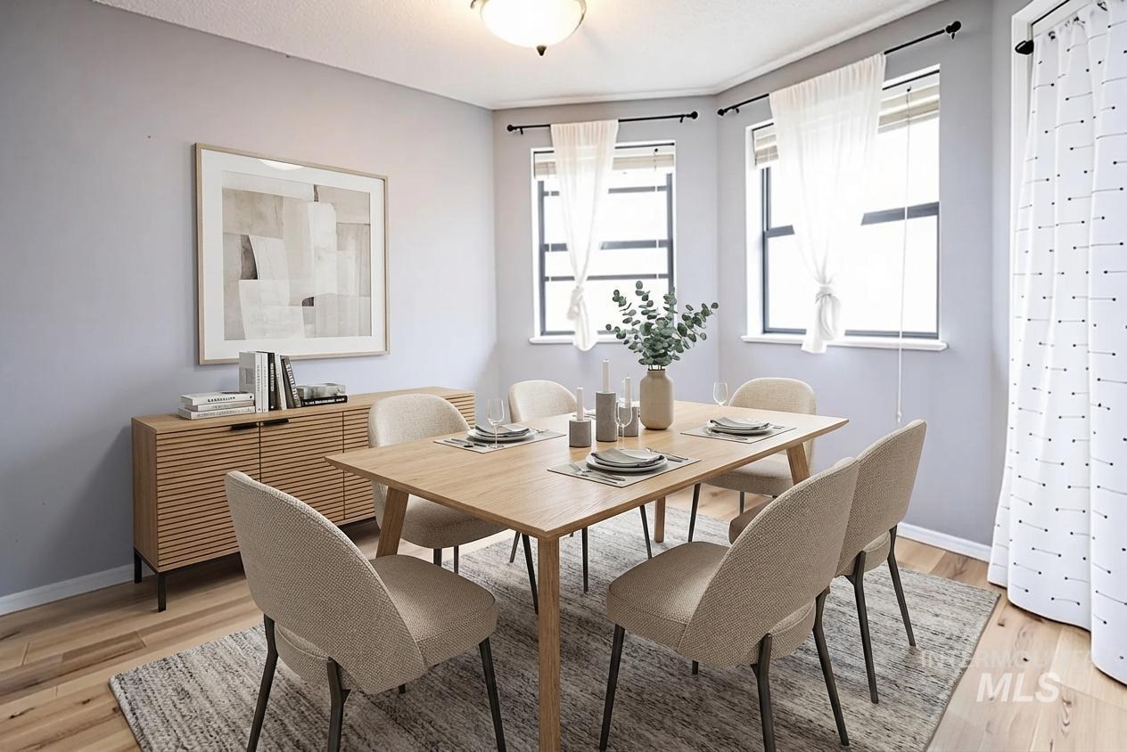 Dining area featuring light wood finished floors and baseboards