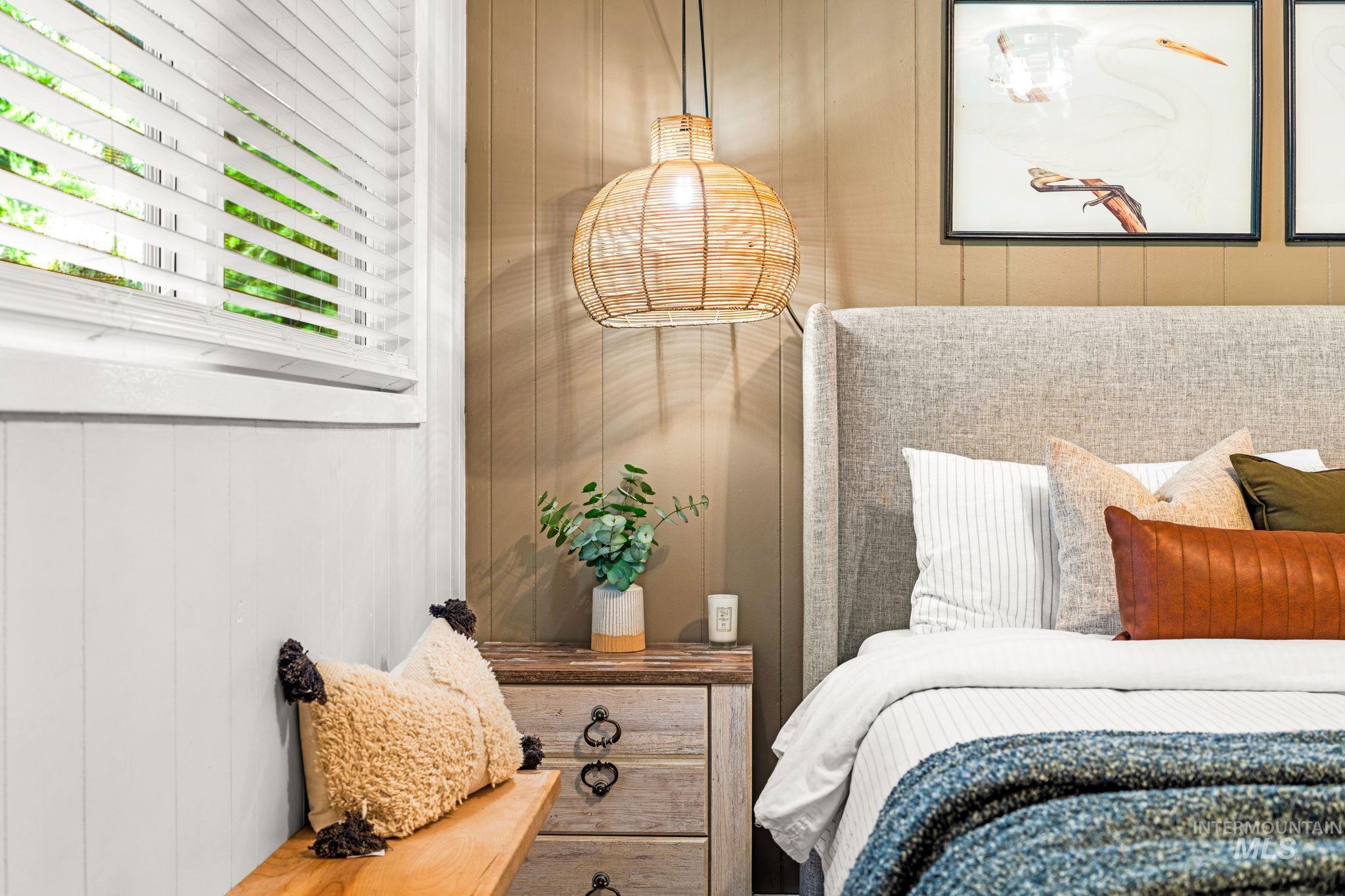 Bedroom with a decorative wall