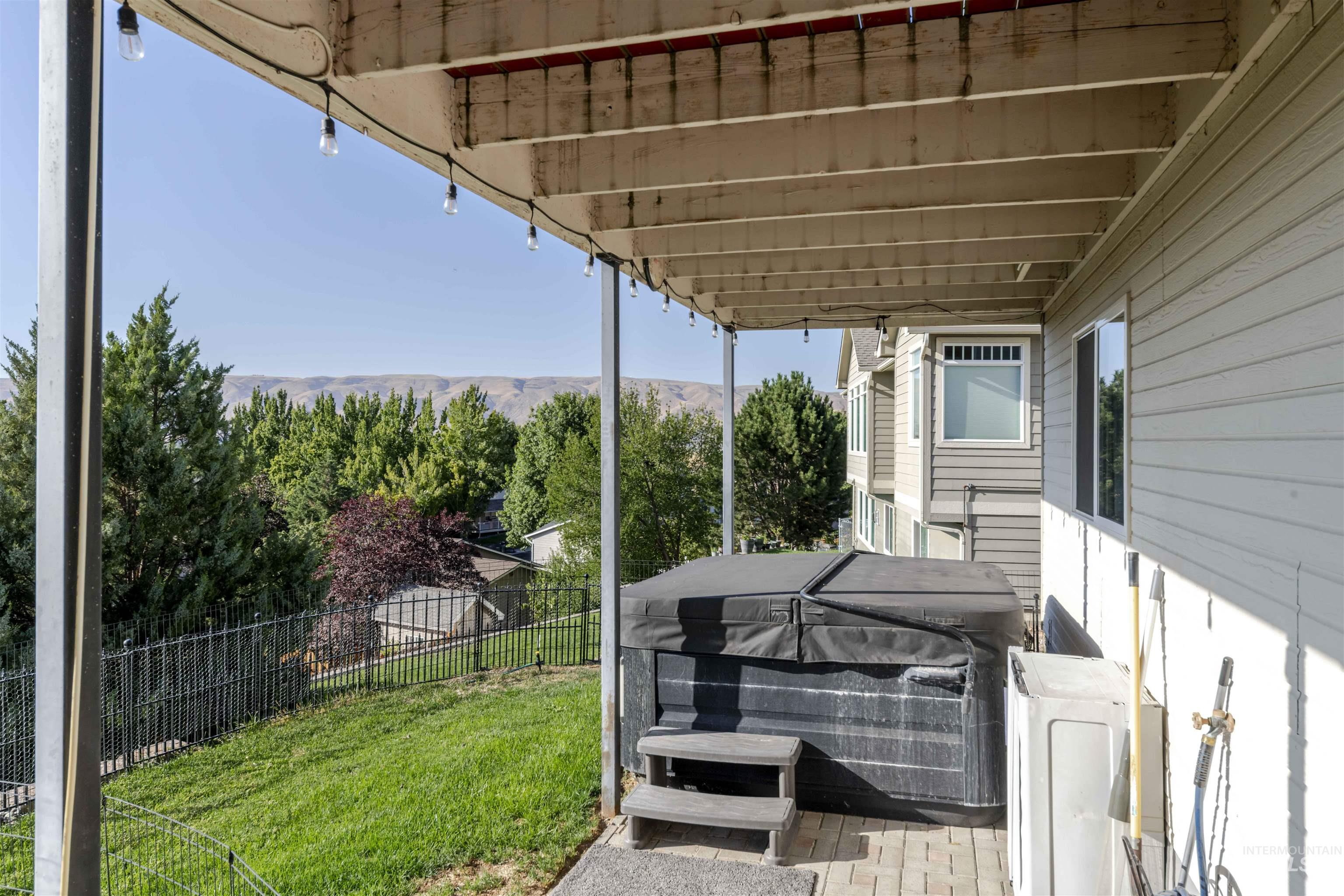 Deck featuring a hot tub