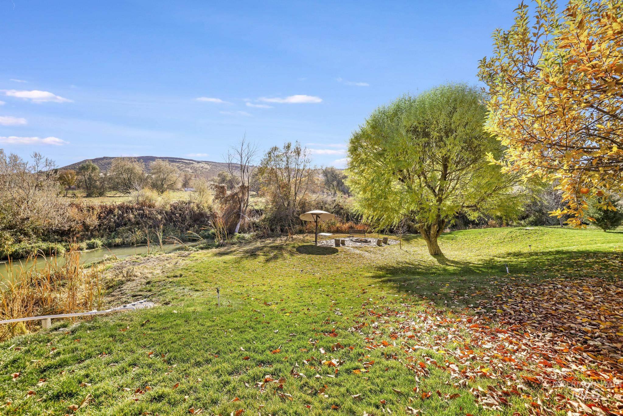 View of grassy yard featuring a mountain view