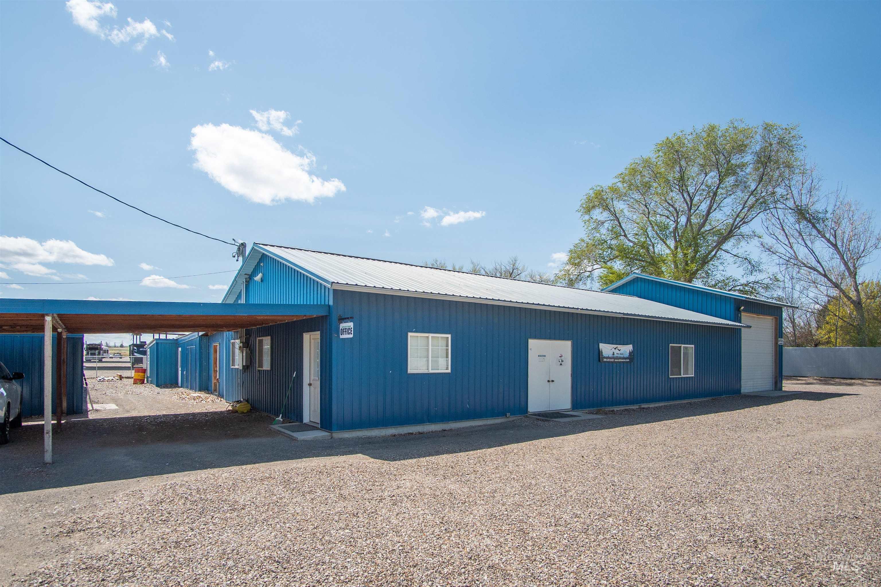 Garage featuring a carport