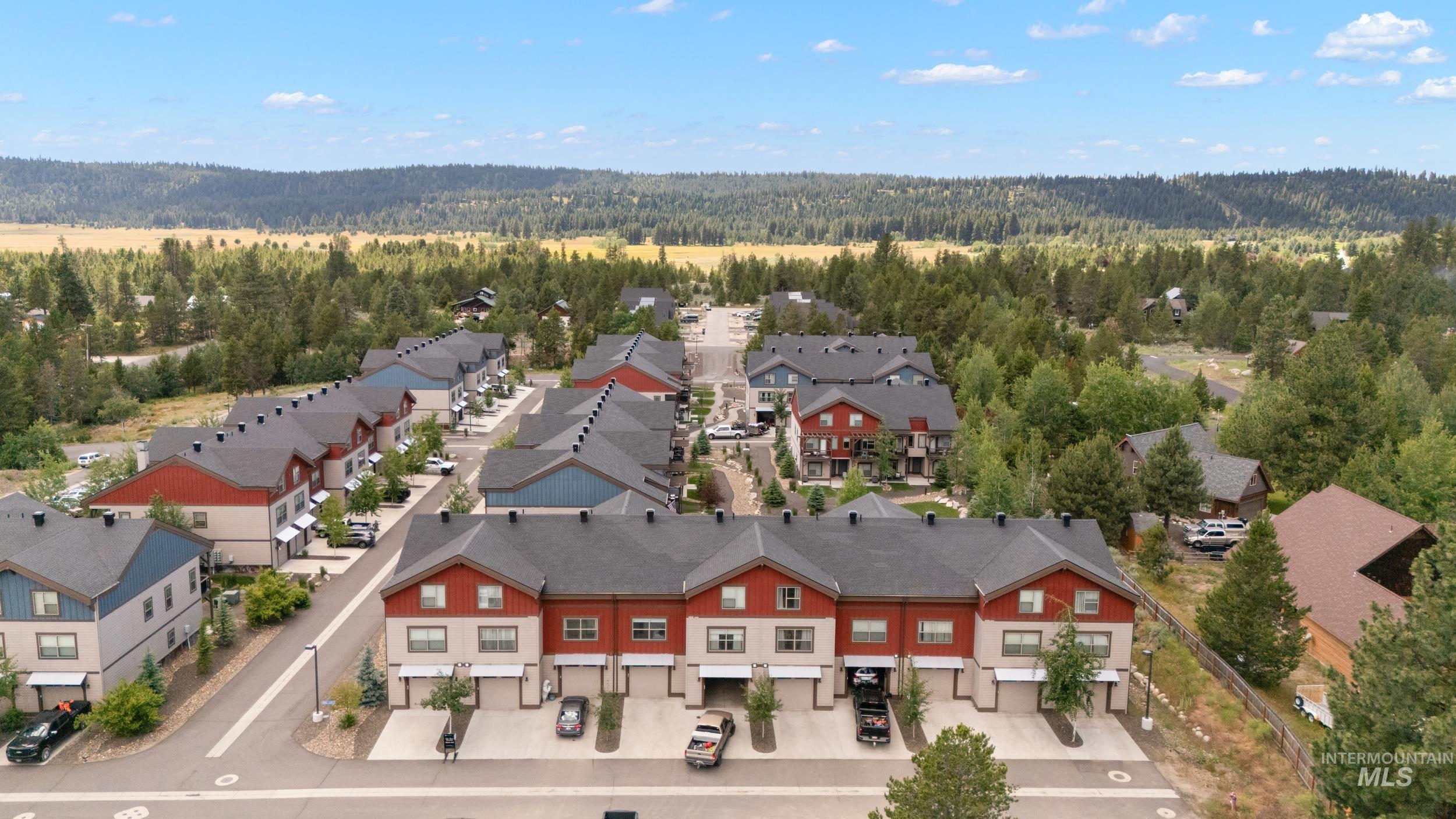 Contemporary townhome community featuring multi-story units with attached garages