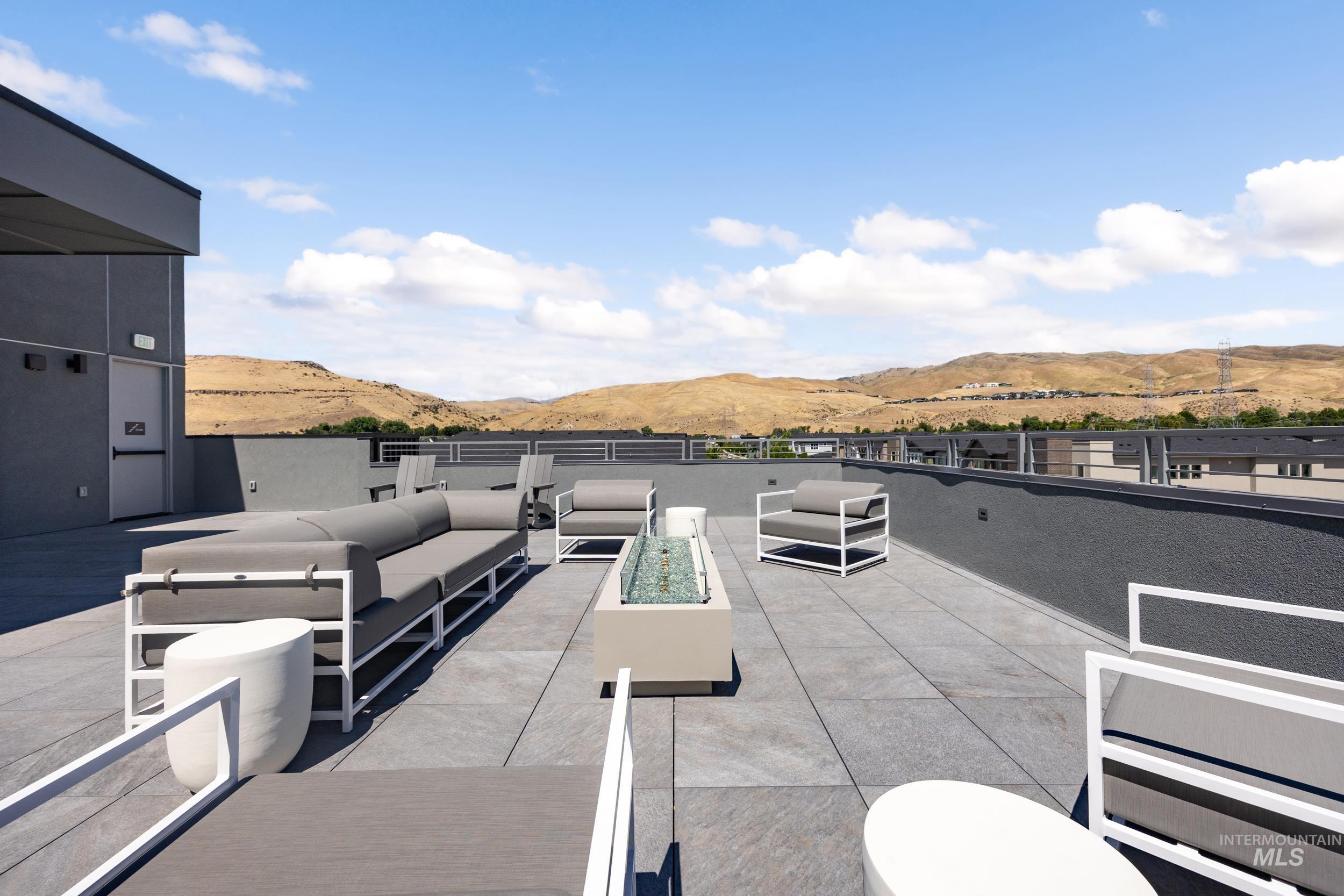 View of patio / terrace with a mountain view and an outdoor living space
