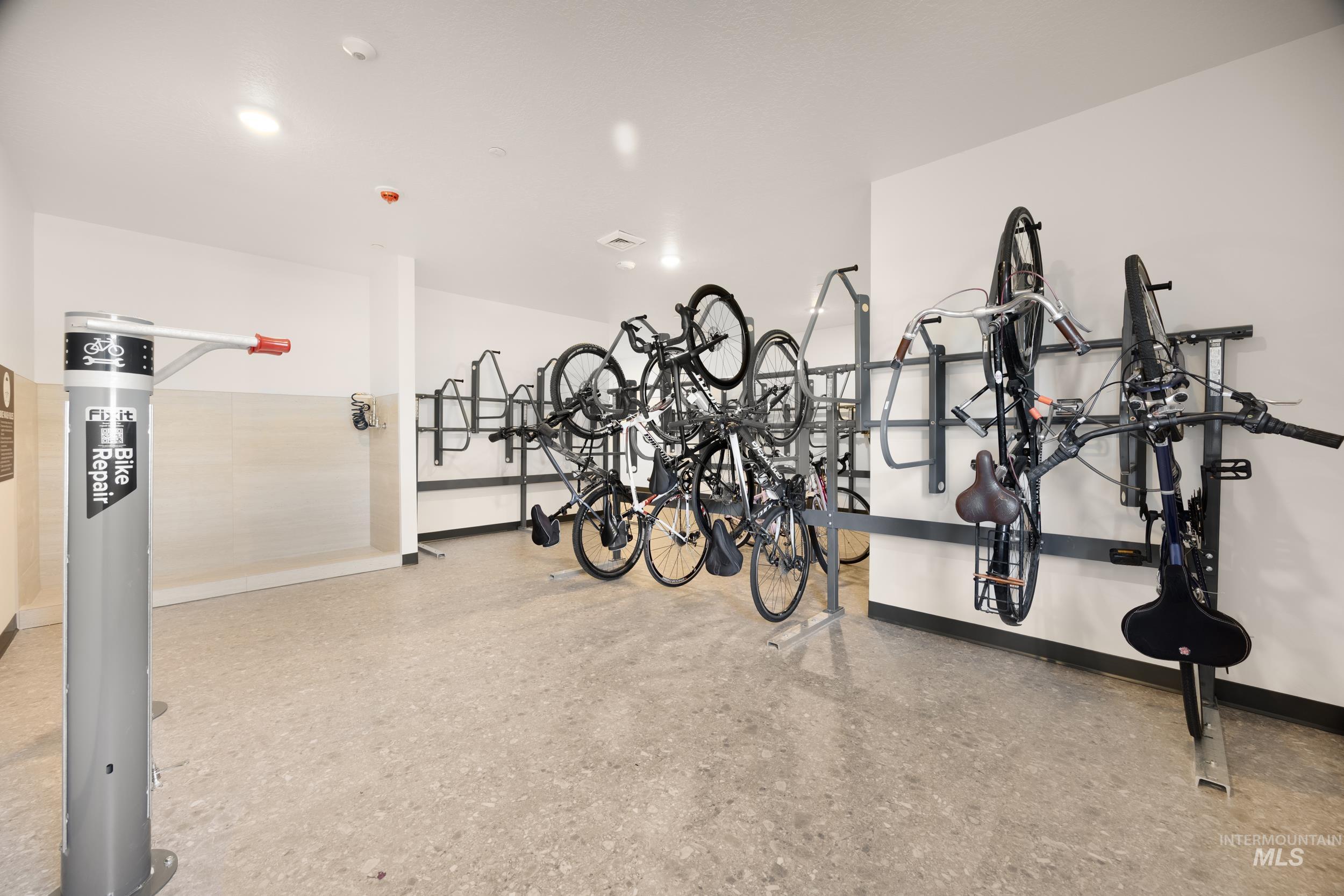 Garage featuring baseboards and bike storage