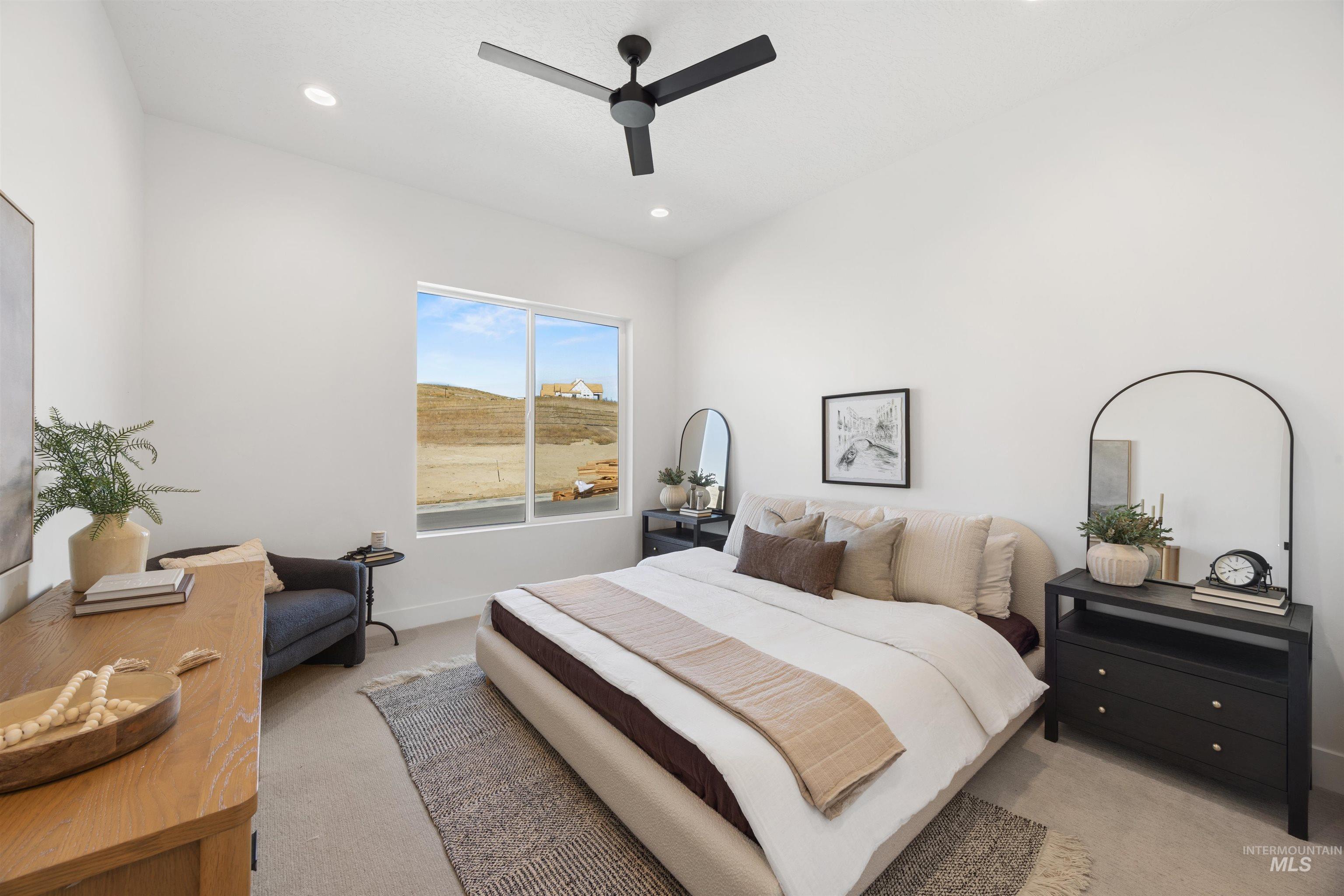 Bedroom with light carpet, a ceiling fan, and recessed lighting