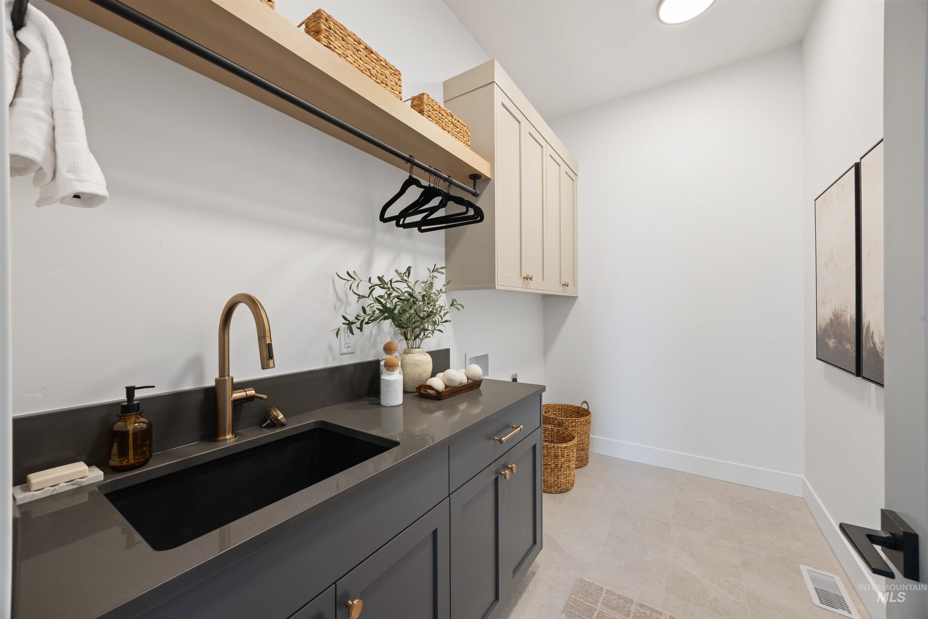 Laundry room featuring cabinet space and washer hookup