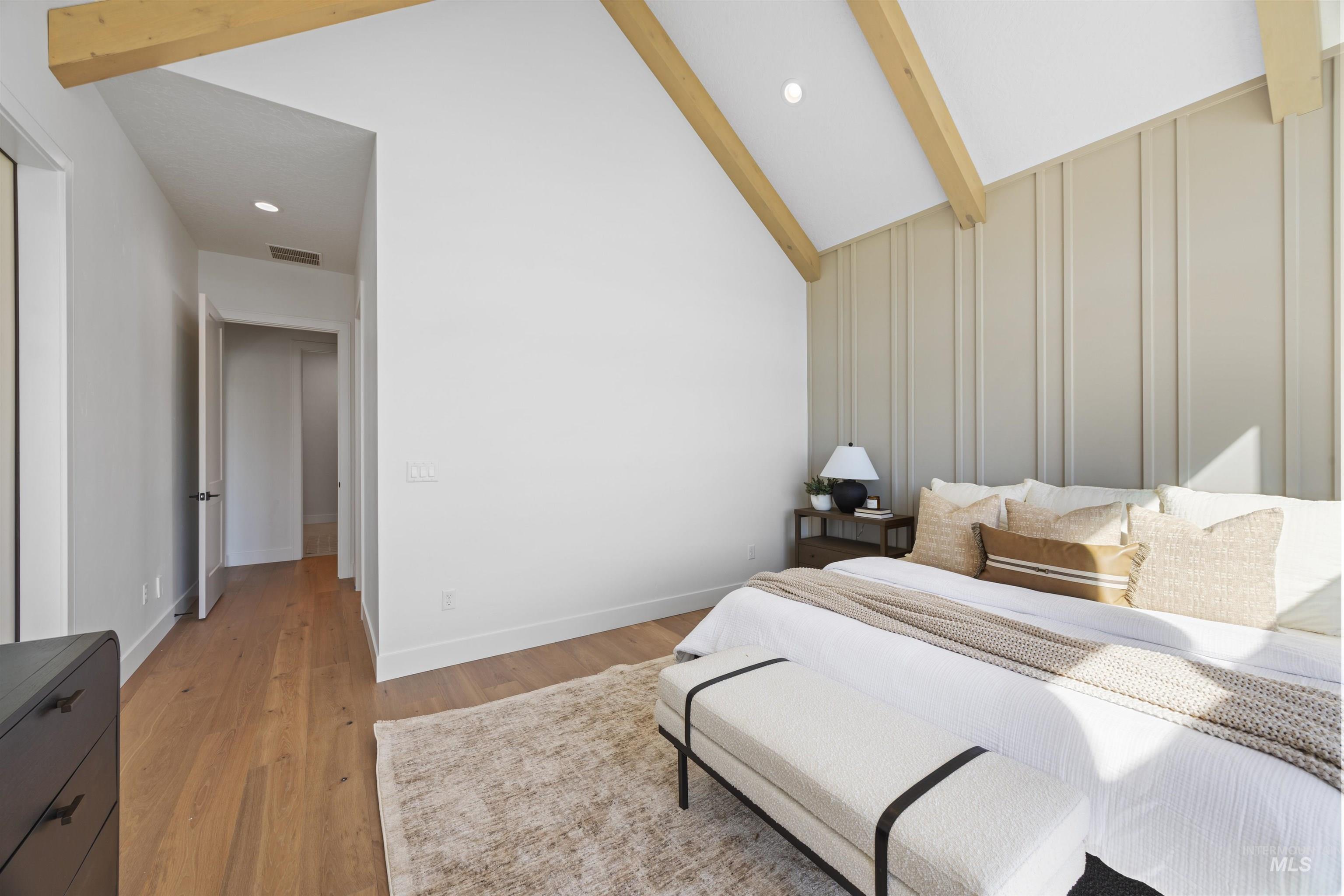 Bedroom with light wood-style floors and recessed lighting