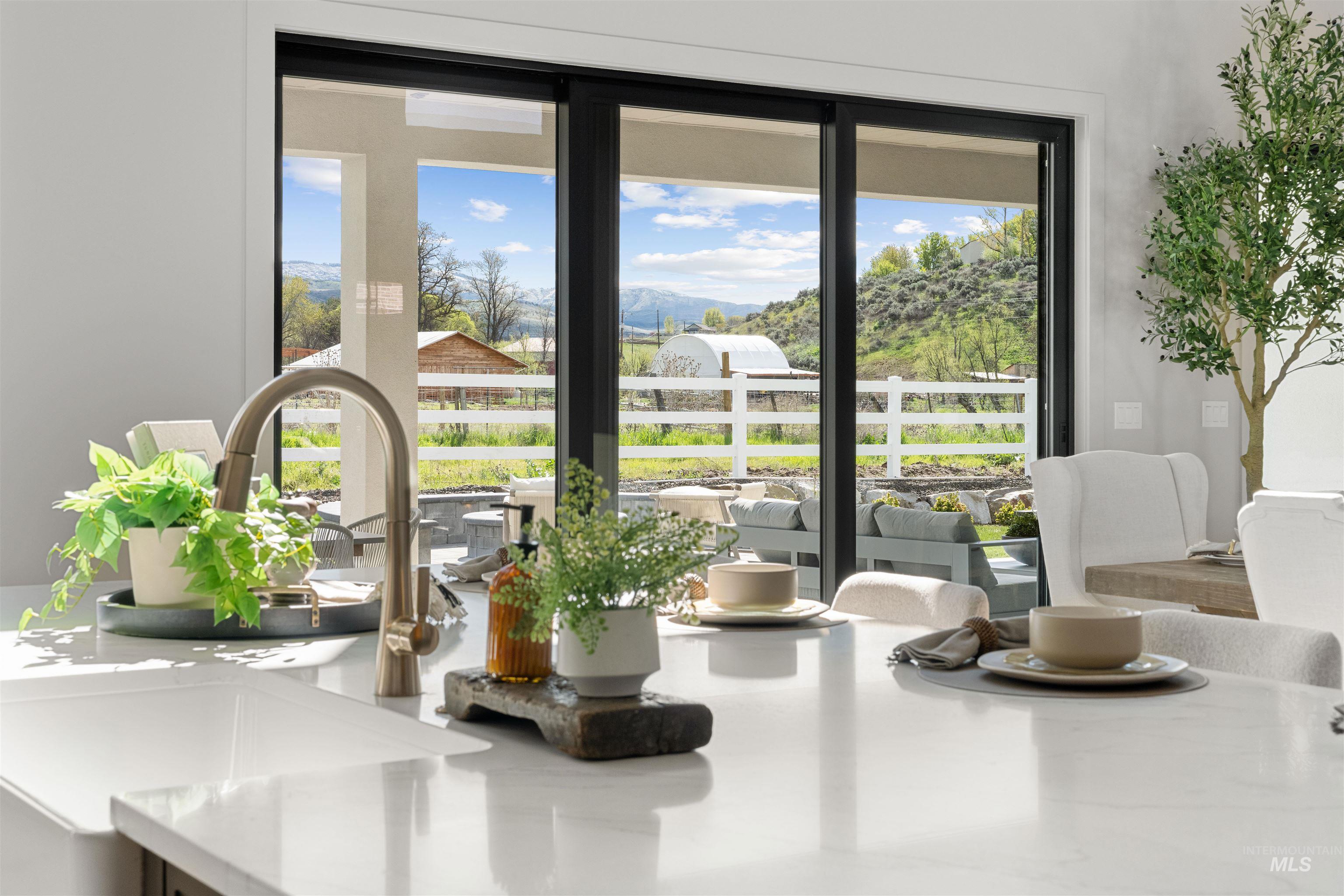 Kitchen island with a gooseneck faucet and a polished countertop