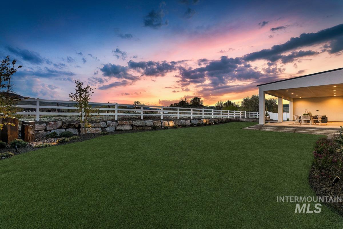 Fenced backyard with a patio