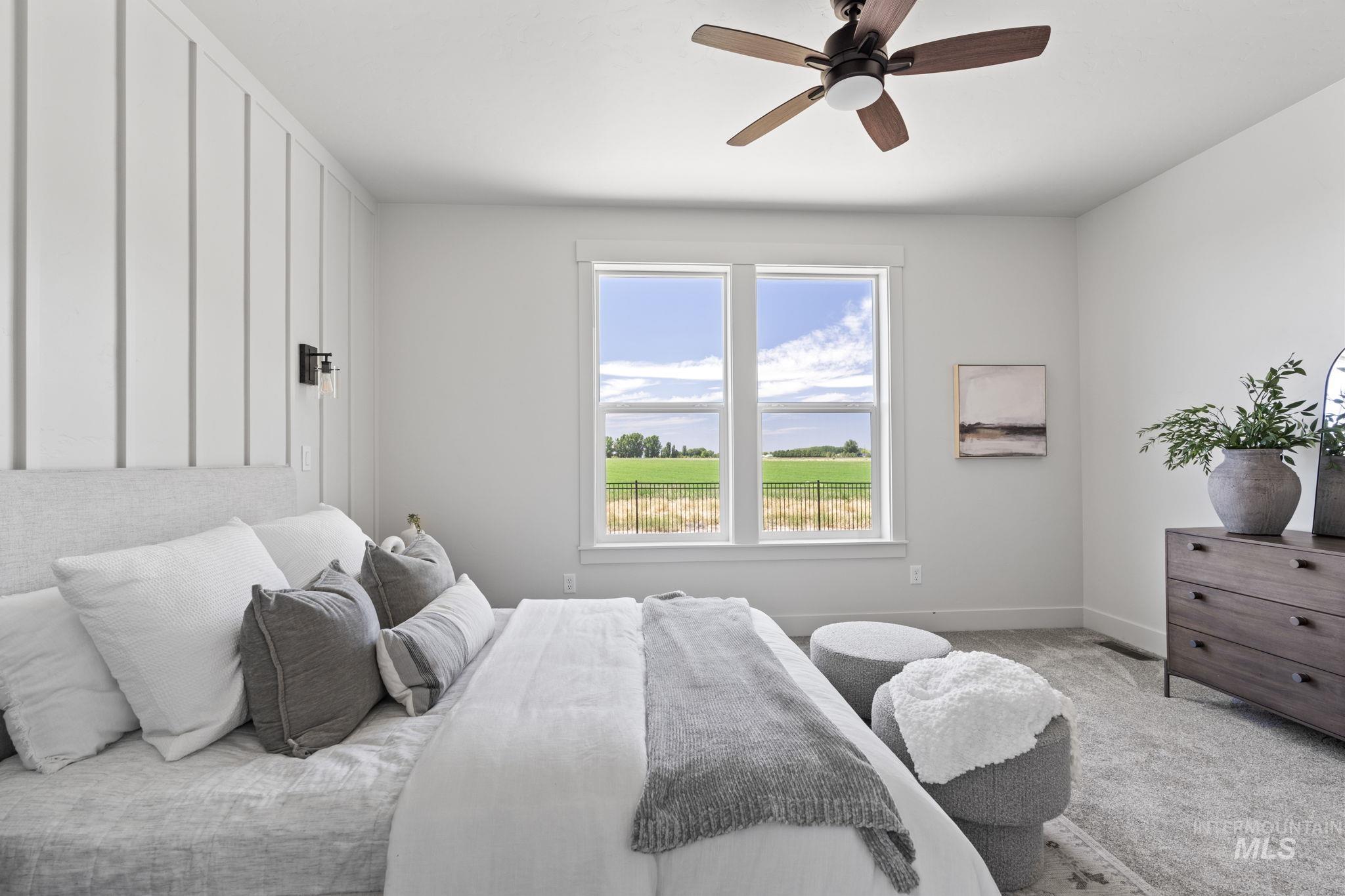 Bedroom featuring carpet and ceiling fan