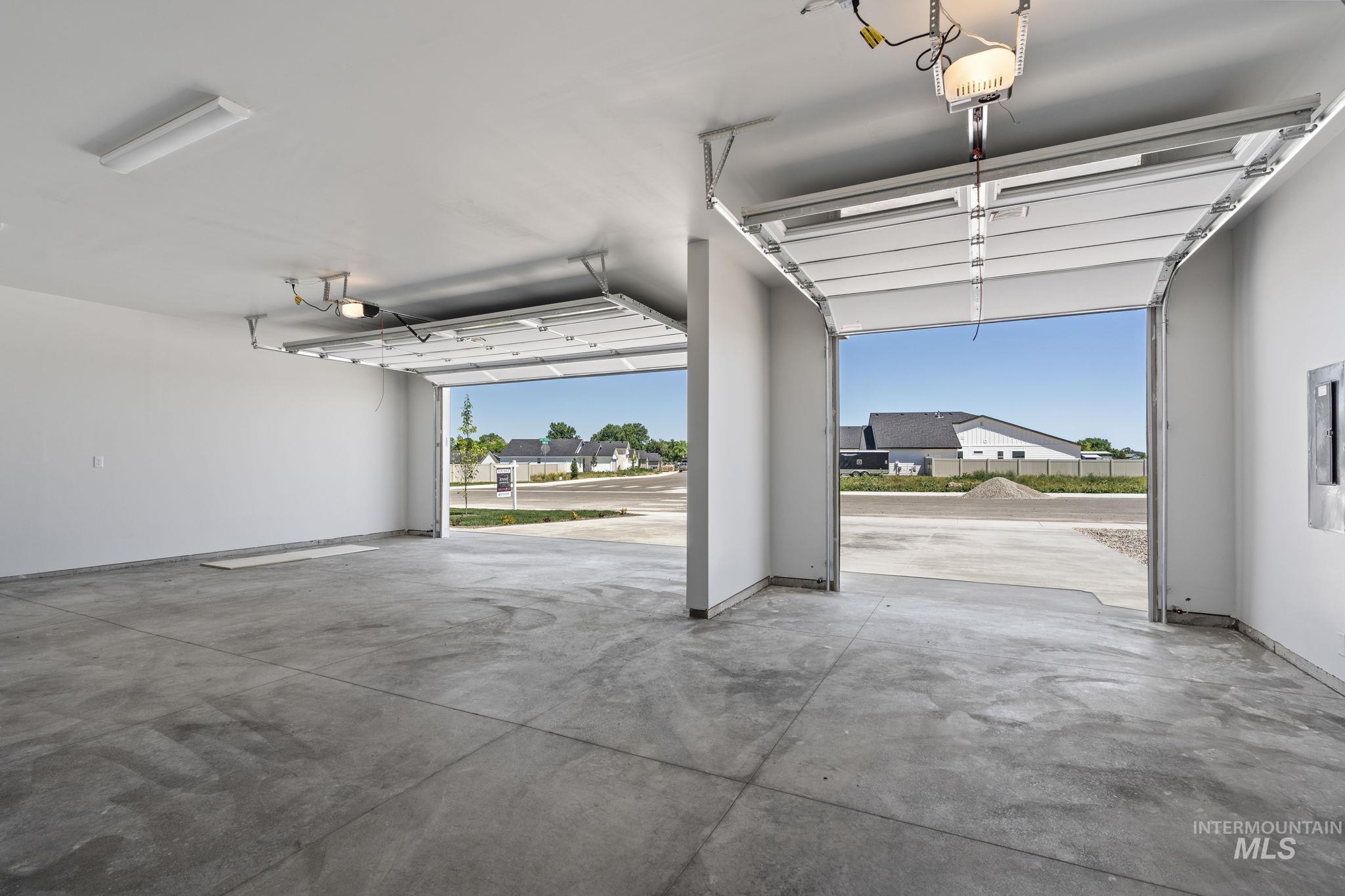 Garage with a residential view and a garage door opener