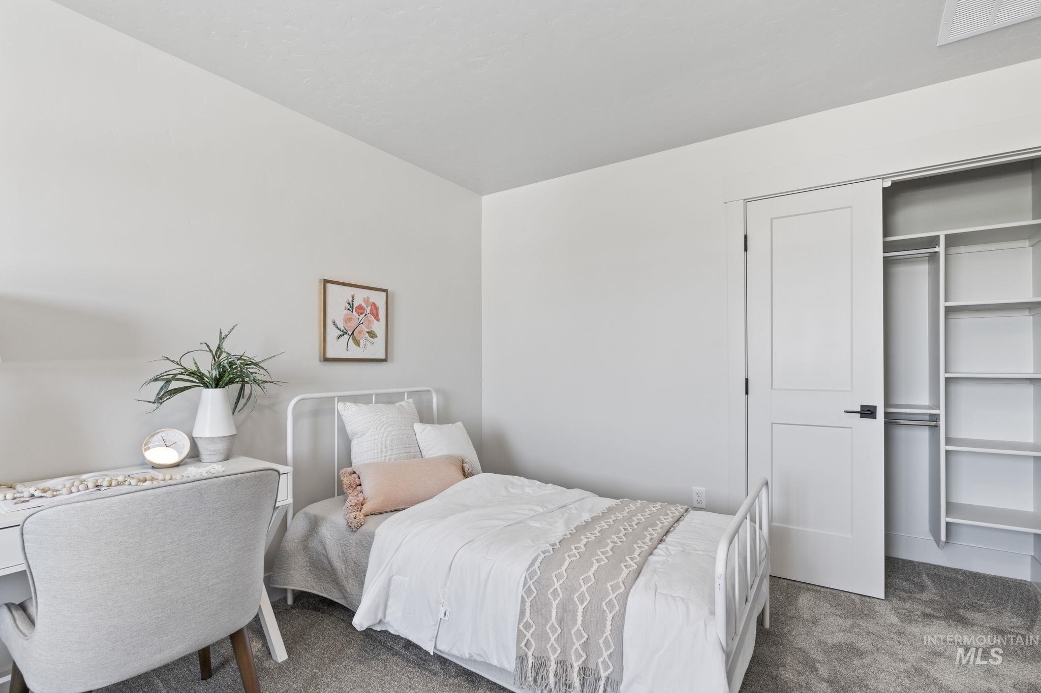 Bedroom with carpet and a closet
