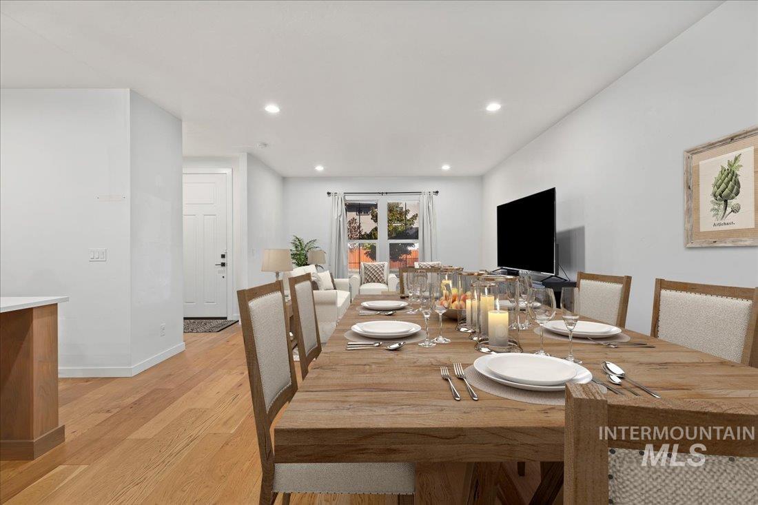 Dining space featuring light wood-type flooring and recessed lighting