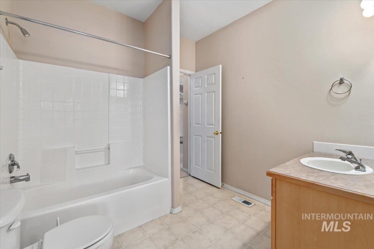 Bathroom featuring vanity and tub / shower combination