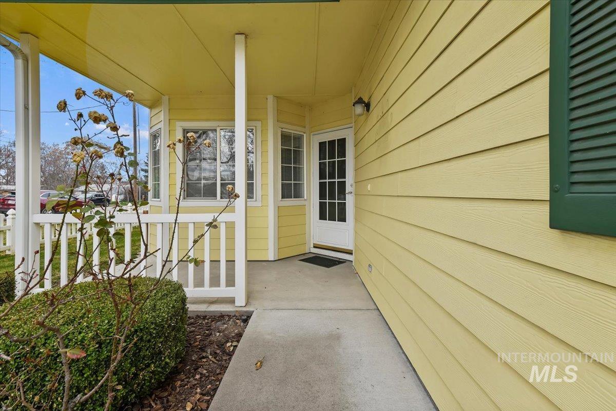 Entrance to property featuring covered porch