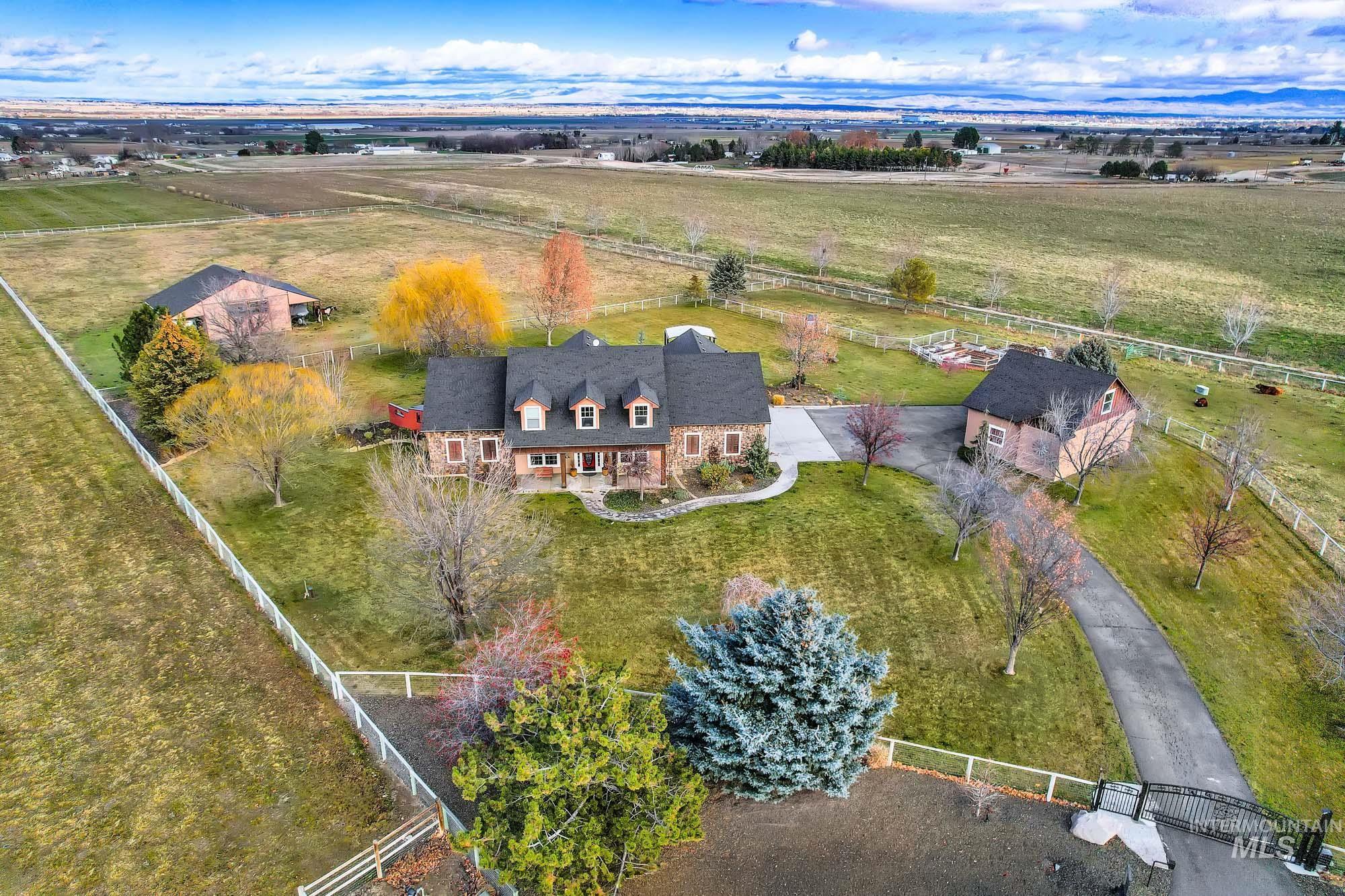 Aerial view of property and surrounding area with rural landscape