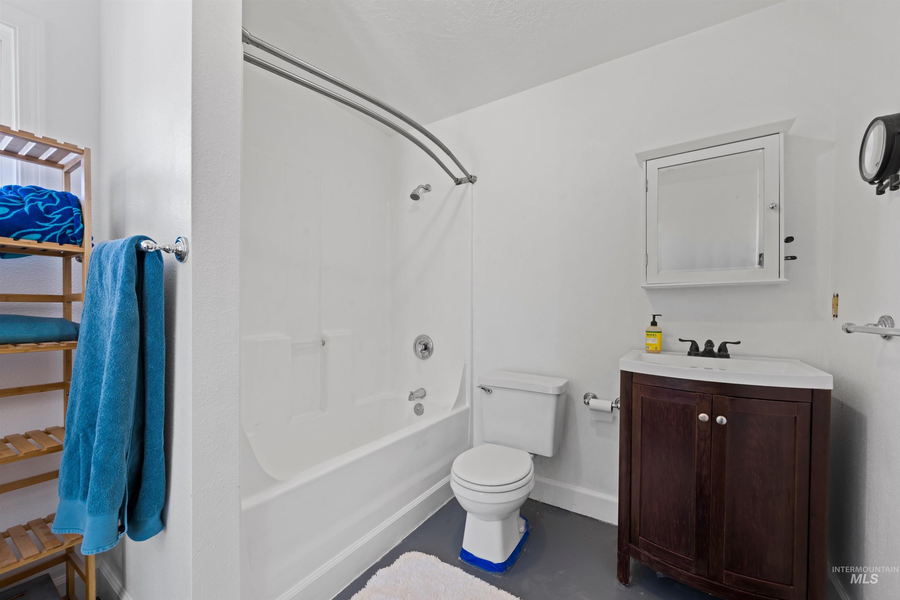Bathroom featuring bathtub / shower combination and vanity