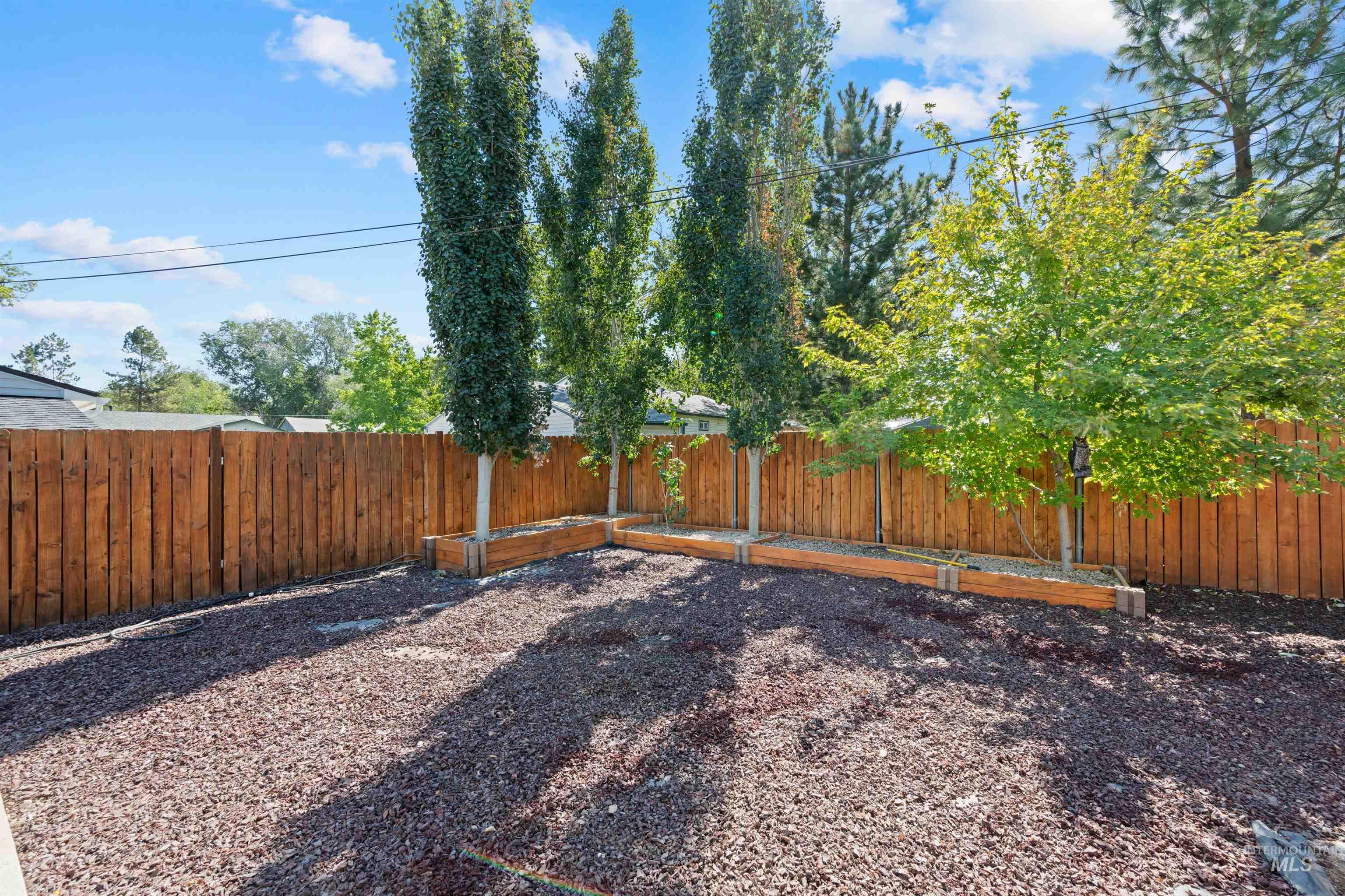 View of fenced backyard