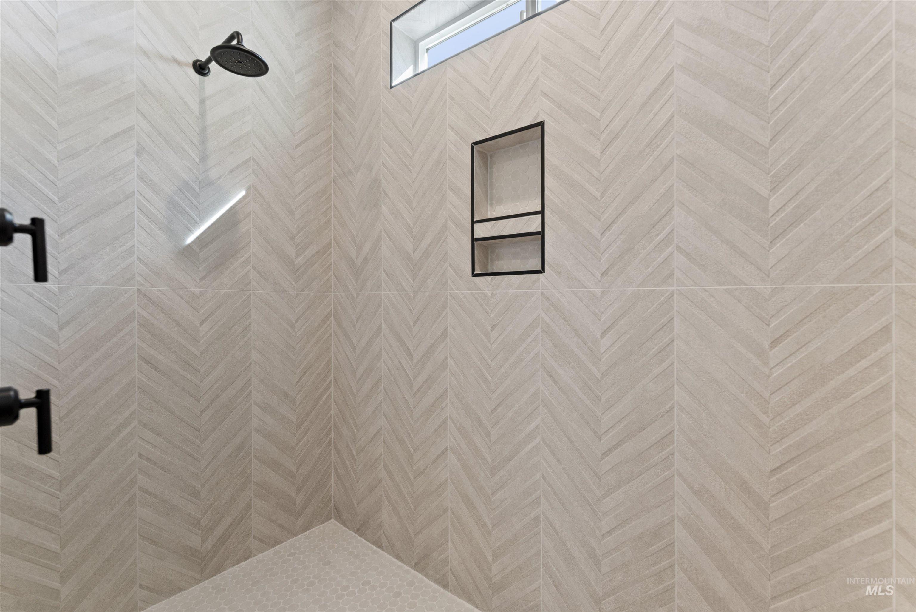 Bathroom view of a tile shower