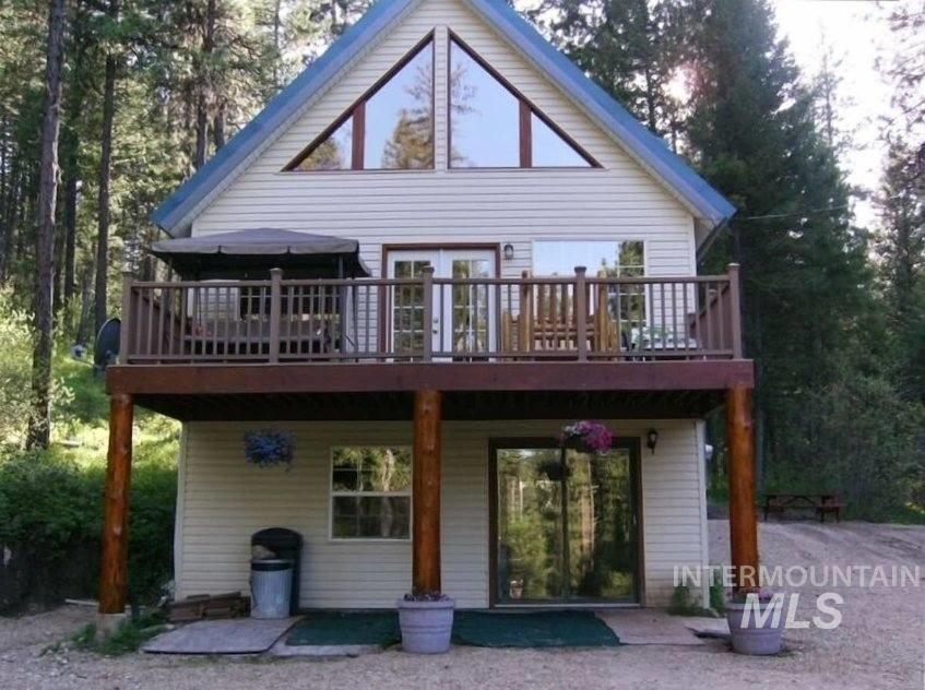 Rear view of property with a deck