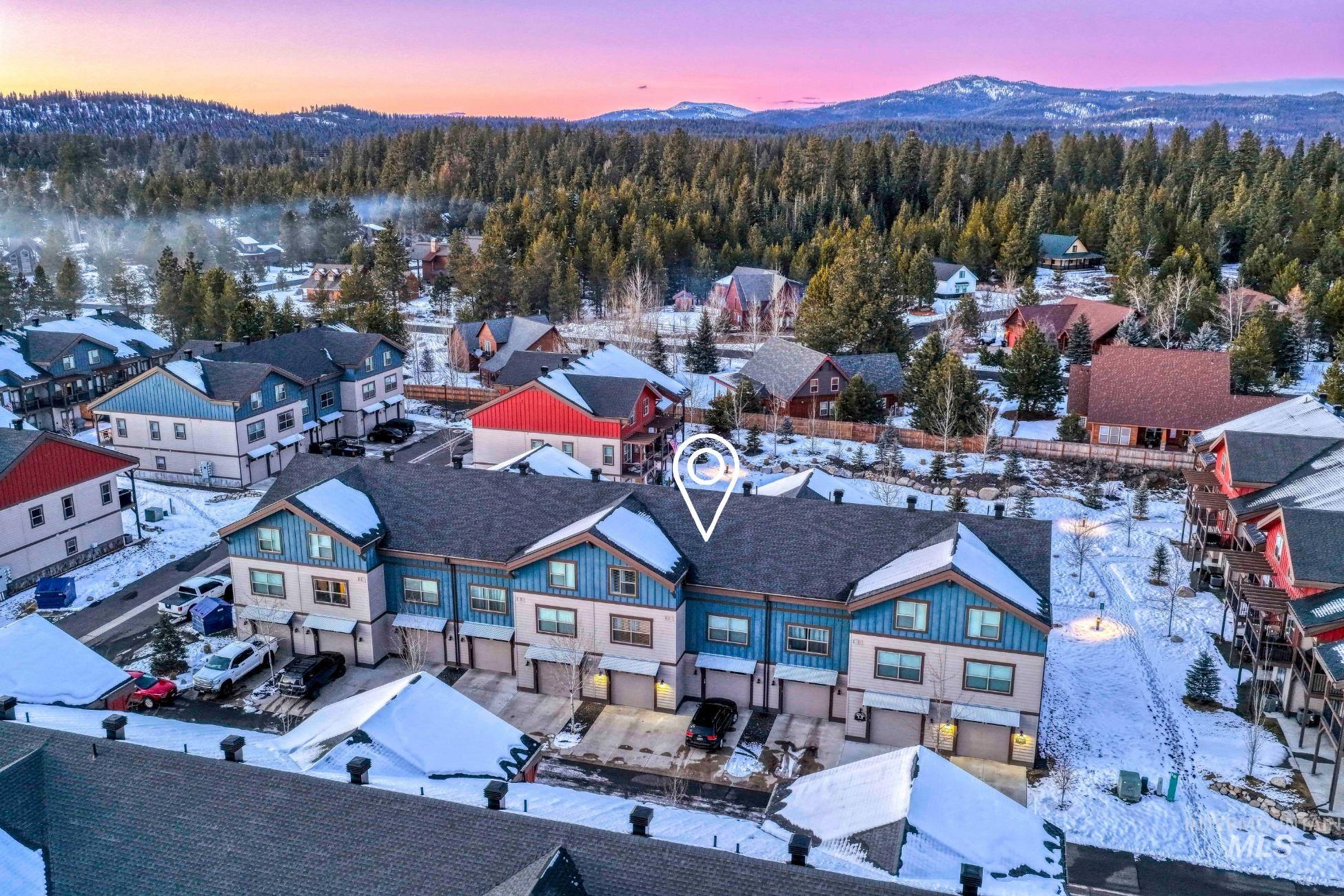 Snowy aerial view with a mountain view