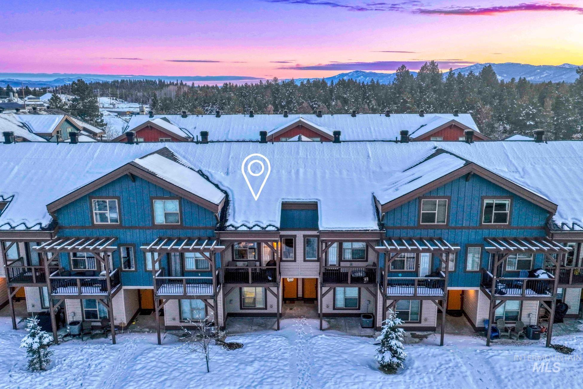 View of front of home featuring a pergola and a patio