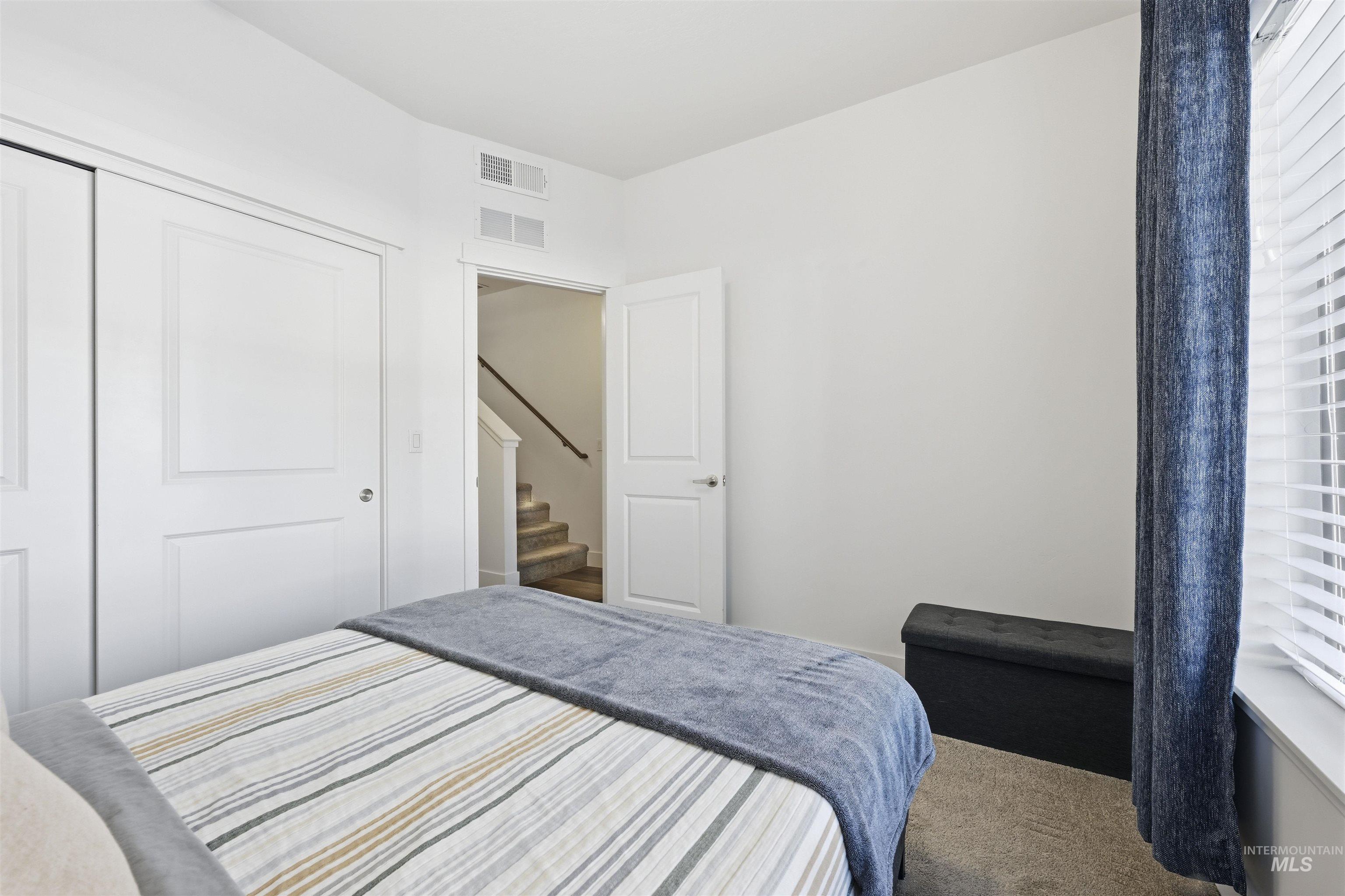 Bedroom with carpet flooring and a closet