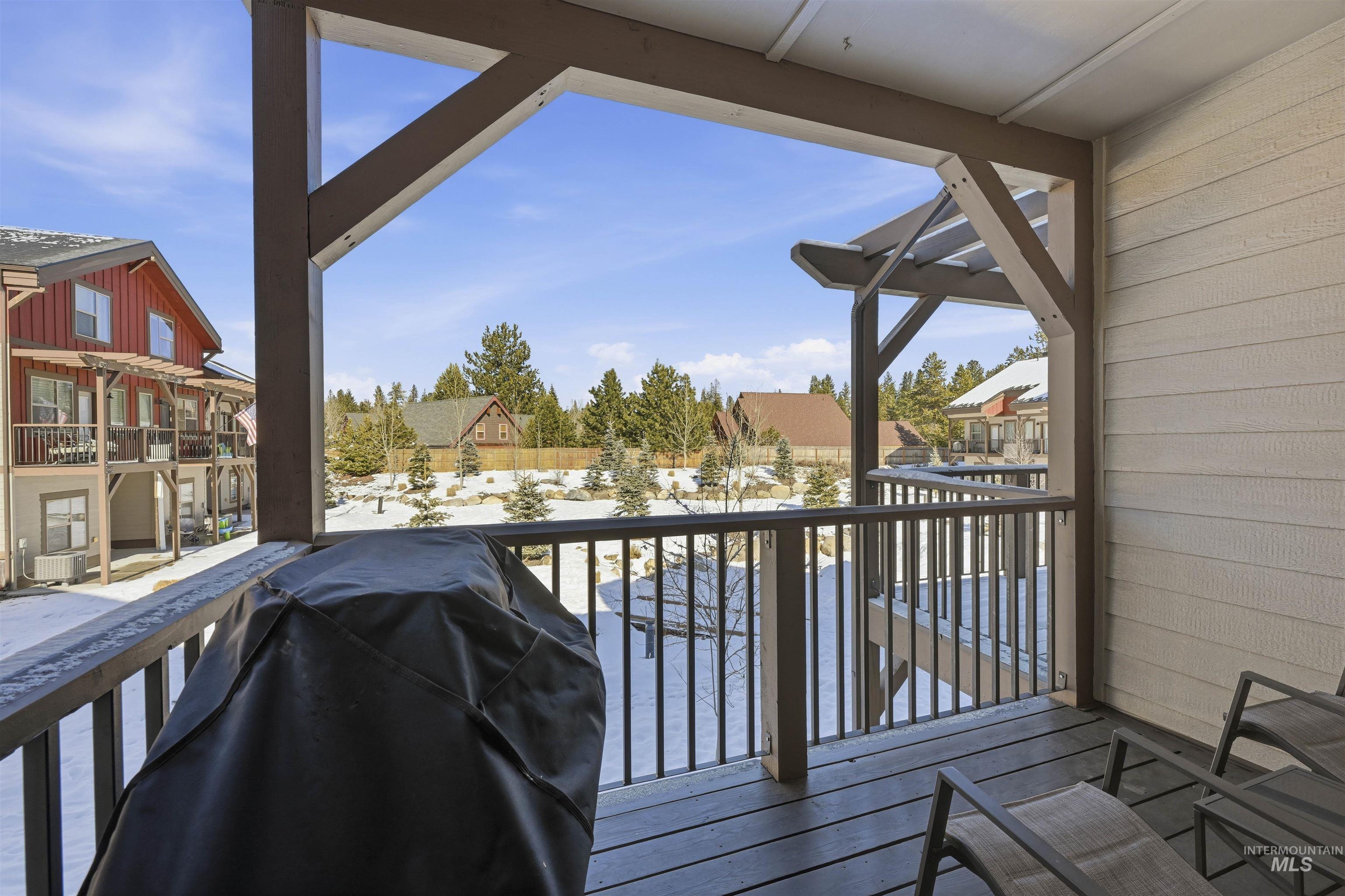 Balcony with area for grilling and a residential view