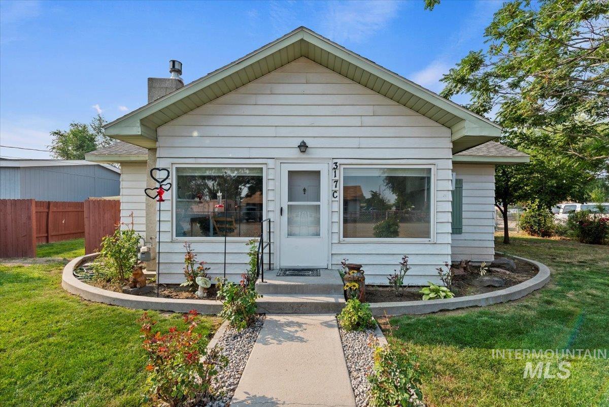 Bungalow-style home with a chimney
