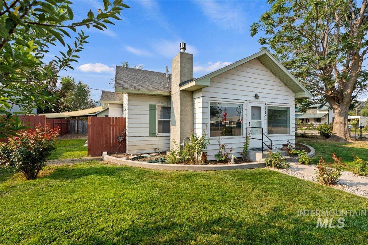 Back of property featuring a chimney